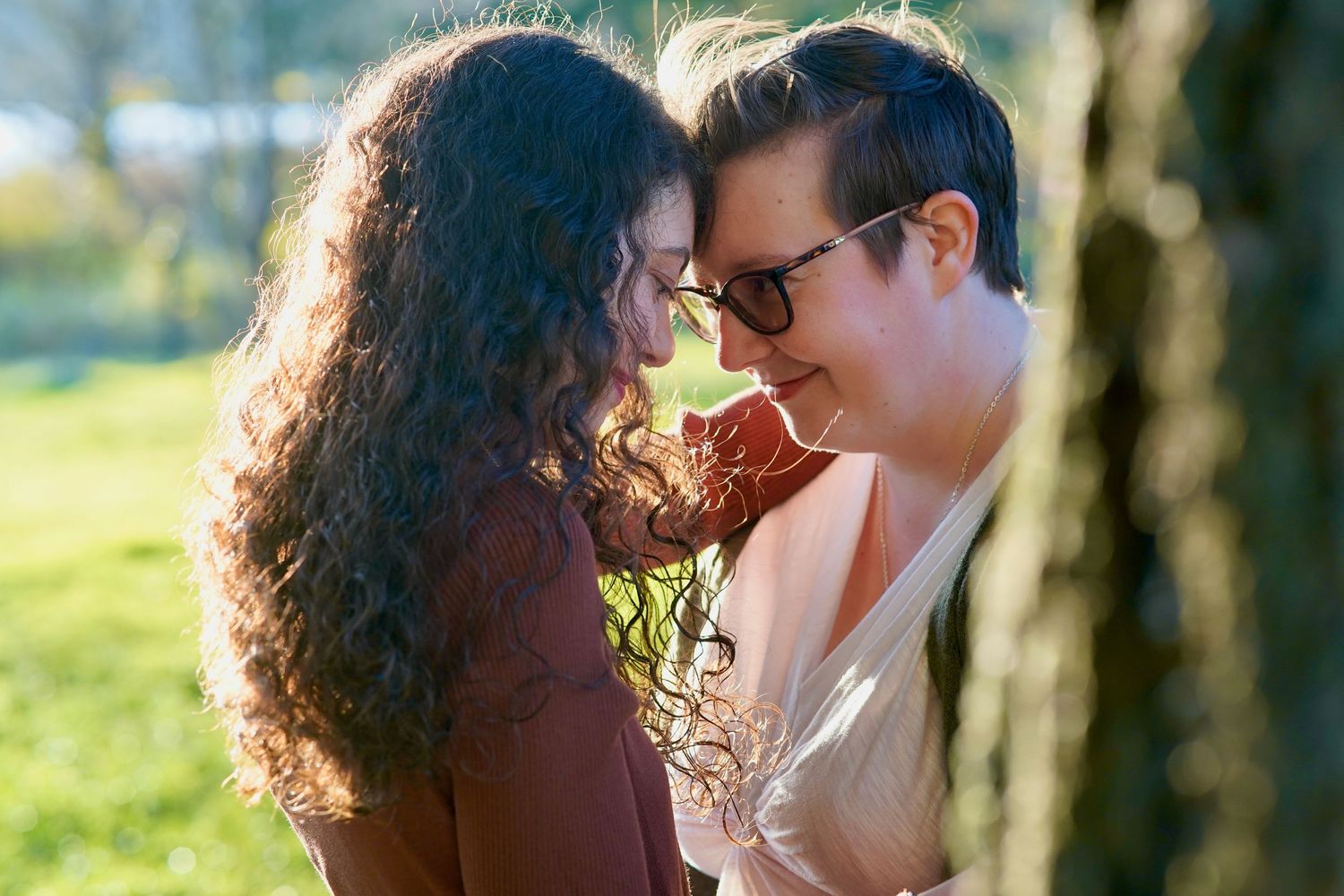 Wedding couple and family group gathered for a formal photo during an intimate wedding in Port Townsend, Washington