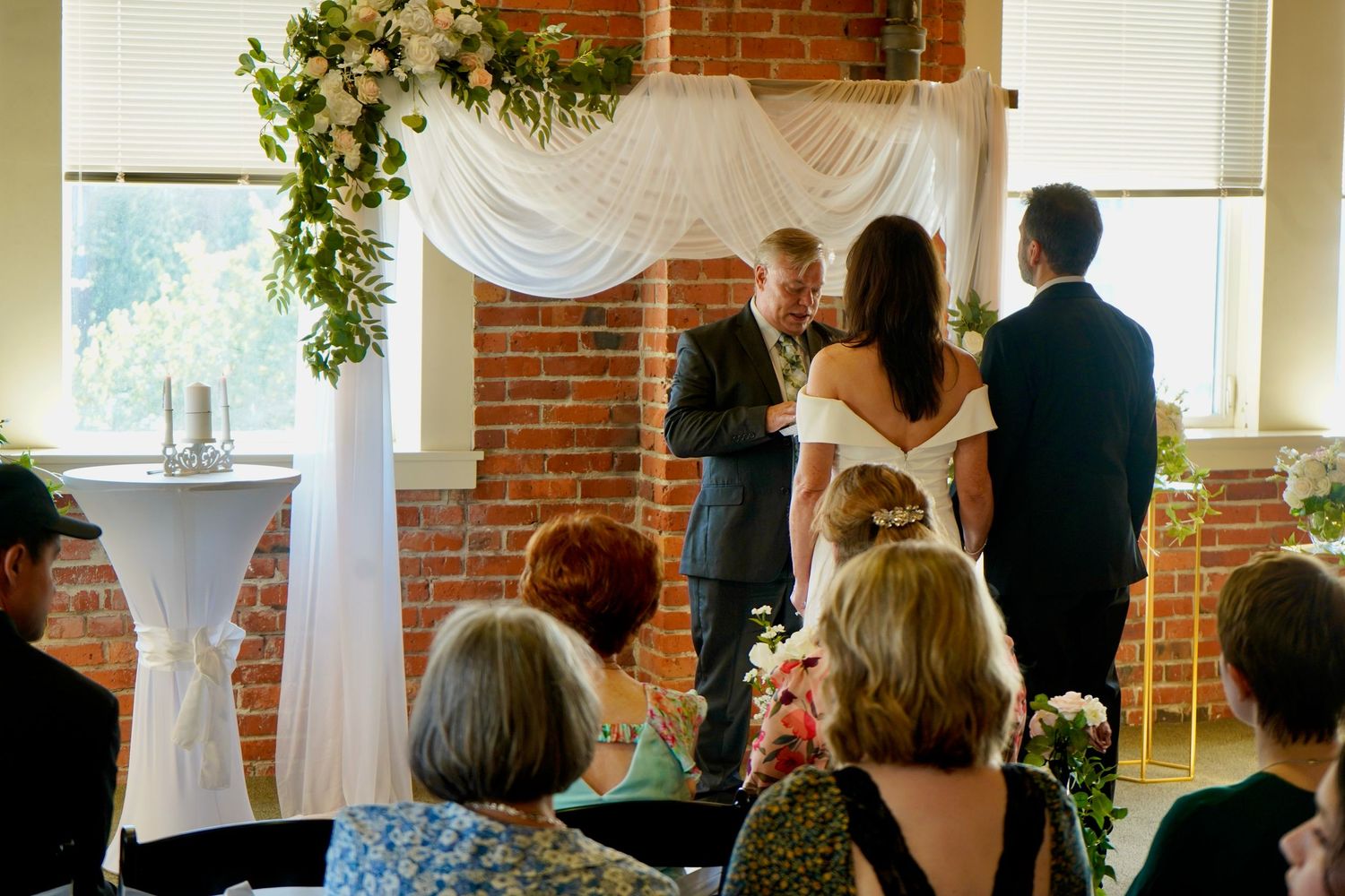 Bride and groom sharing a moment during an intimate wedding ceremony in Port Townsend, Washington