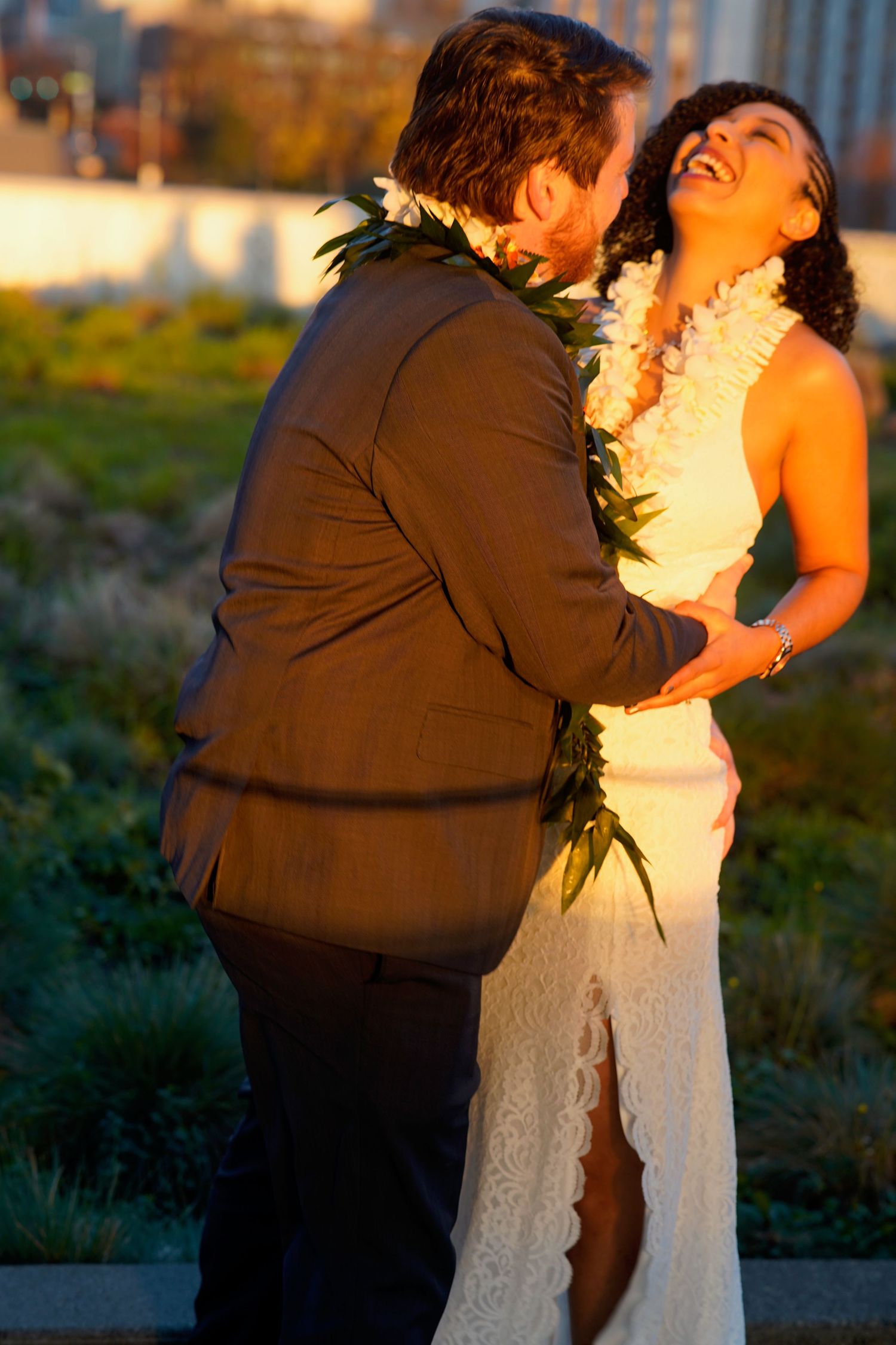 Wedding couple and family group gathered for a formal photo during an intimate wedding in Port Townsend, Washington