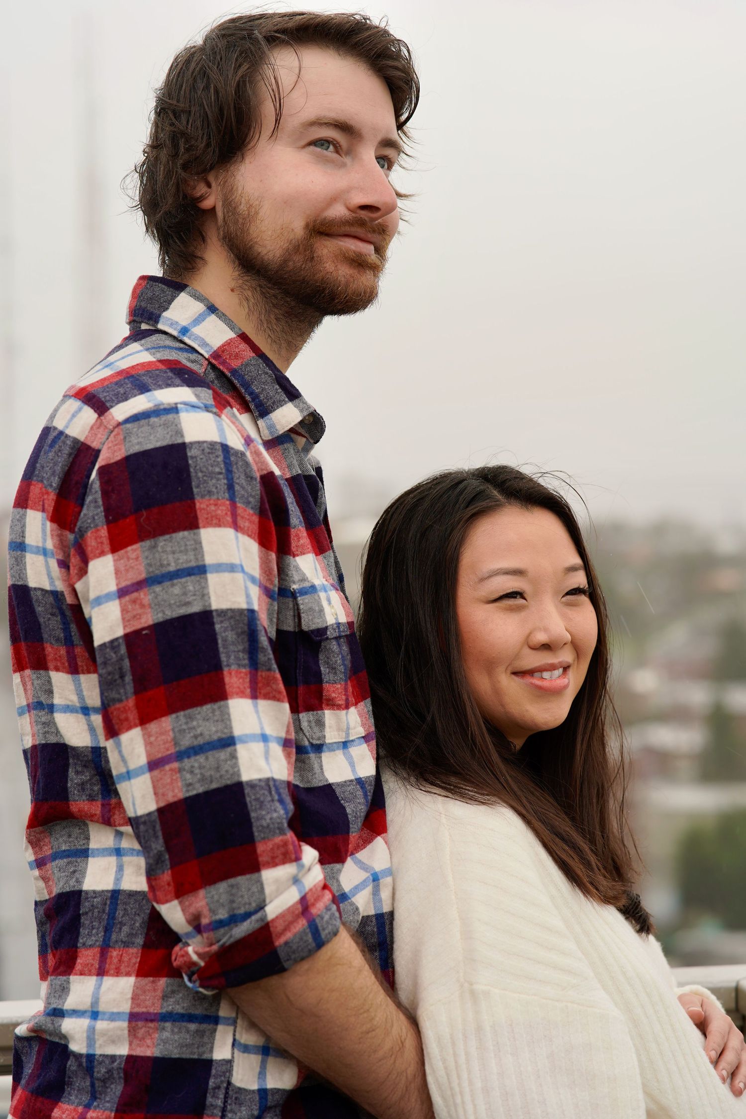 Expectant couple embracing during a natural-light maternity photography session in Port Townsend, Washington