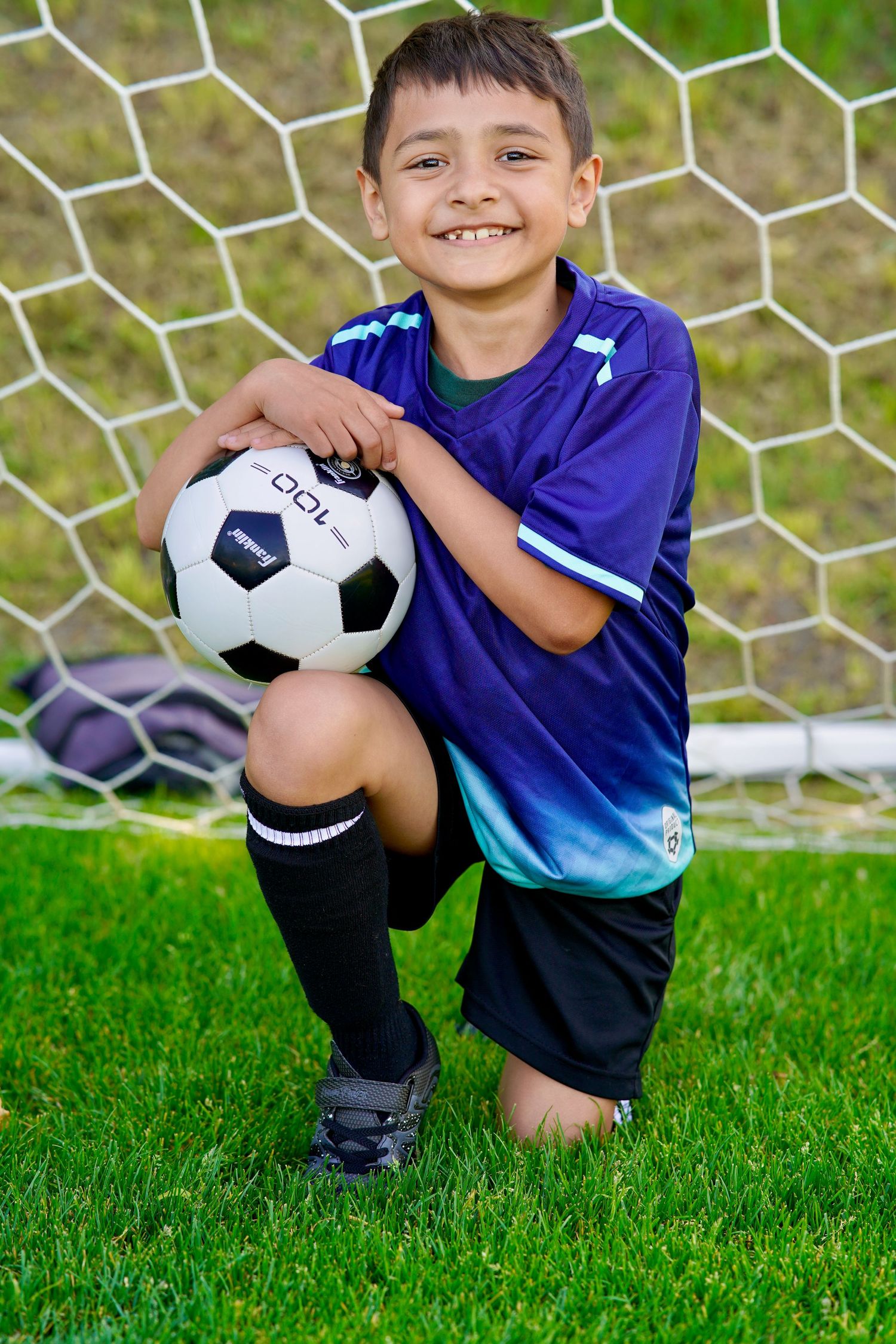 Young soccer players showing their personality and love of the game during a sports portrait session in Port Townsend.