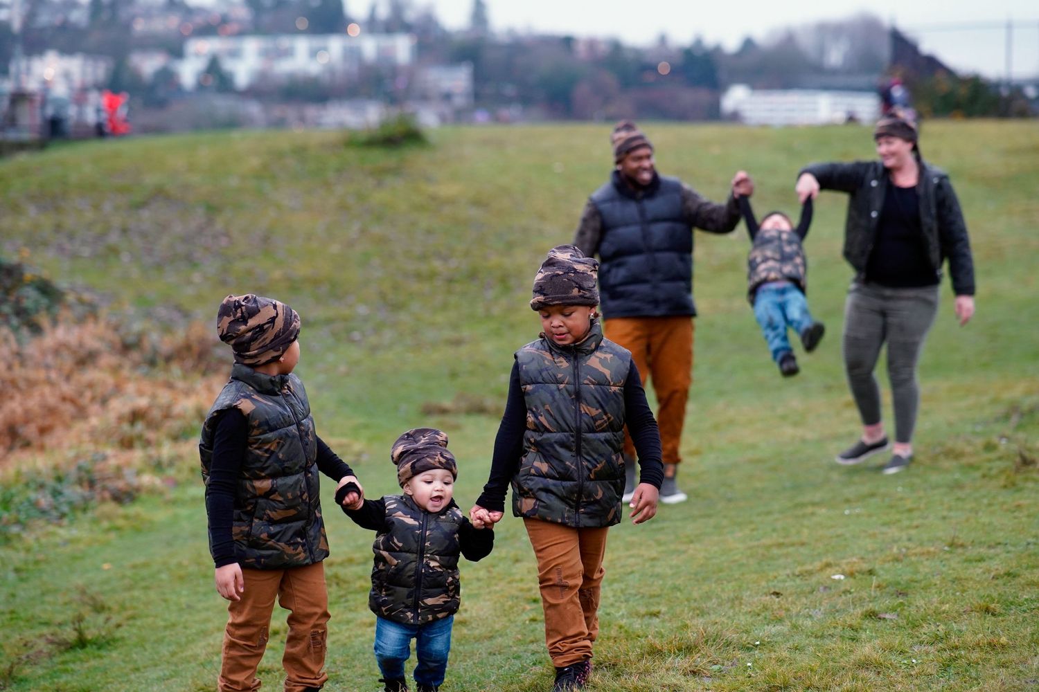 Family enjoying a relaxed outdoor photo session in Port Townsend, Washington