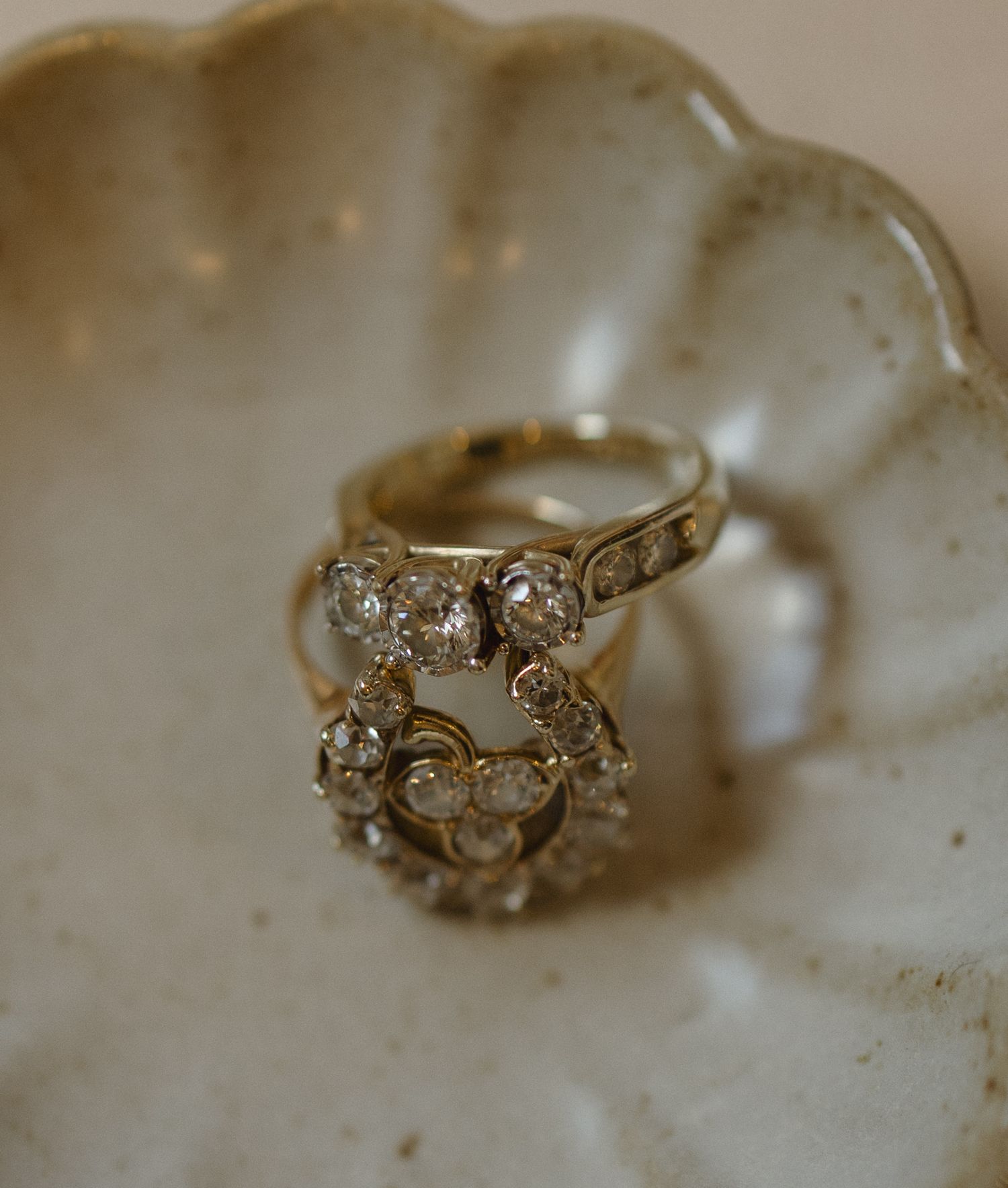 Wedding rings arranged on a small shell-shaped ring dish