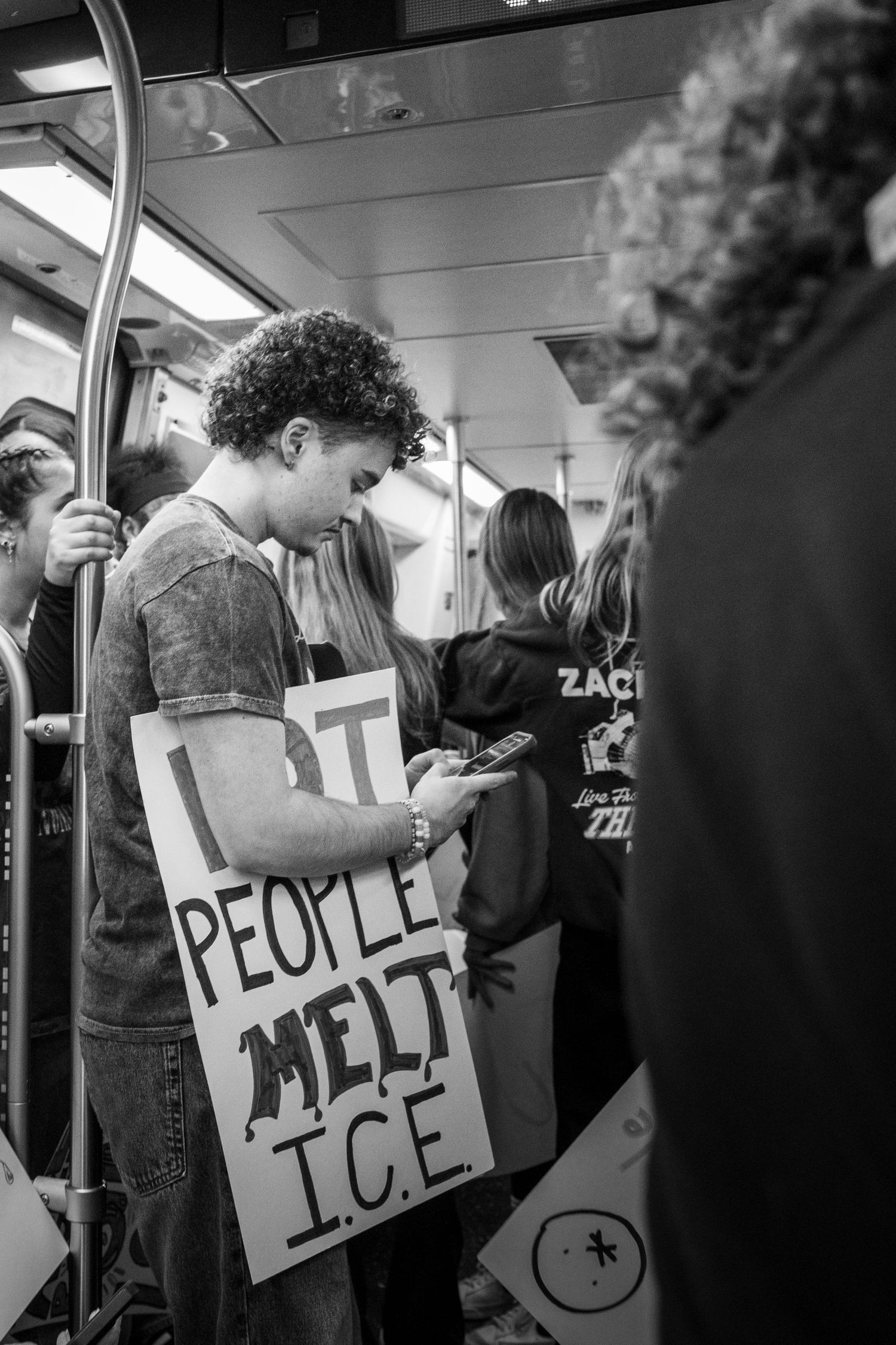 Washington, D.C. — February 27, 2026
Students flood the D.C Metro holding anti-ICE signs