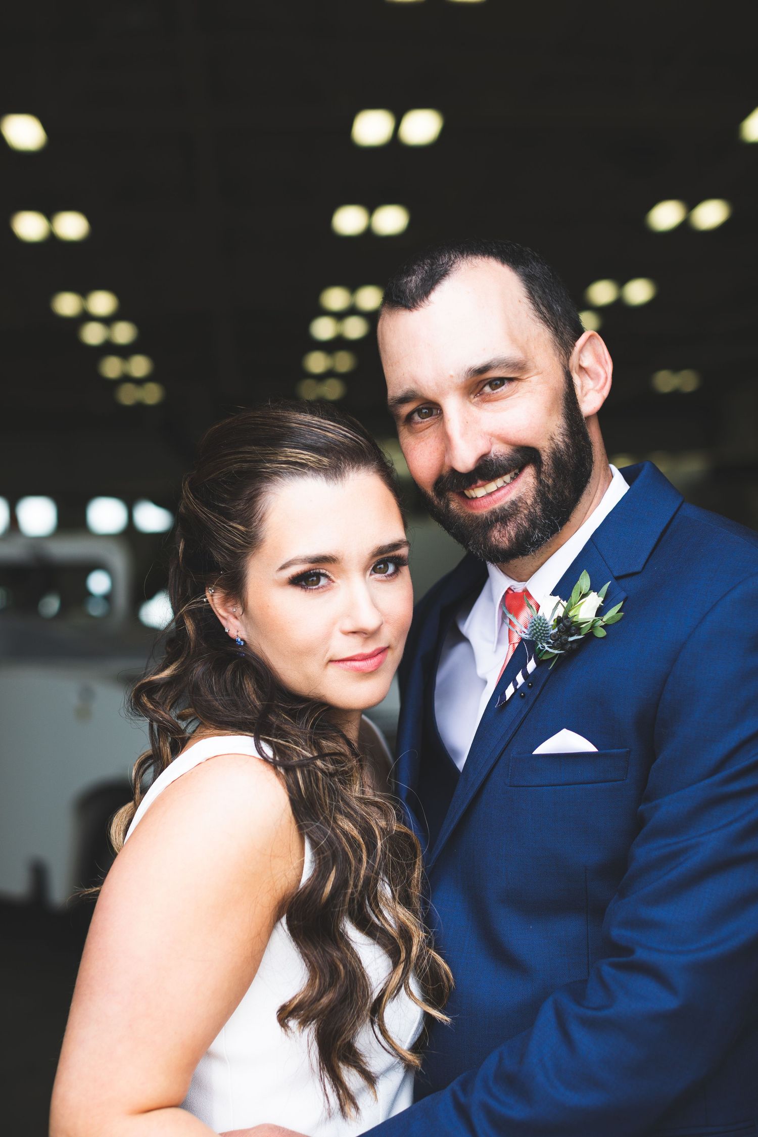 Wedding couple portrait in airplane hanger
