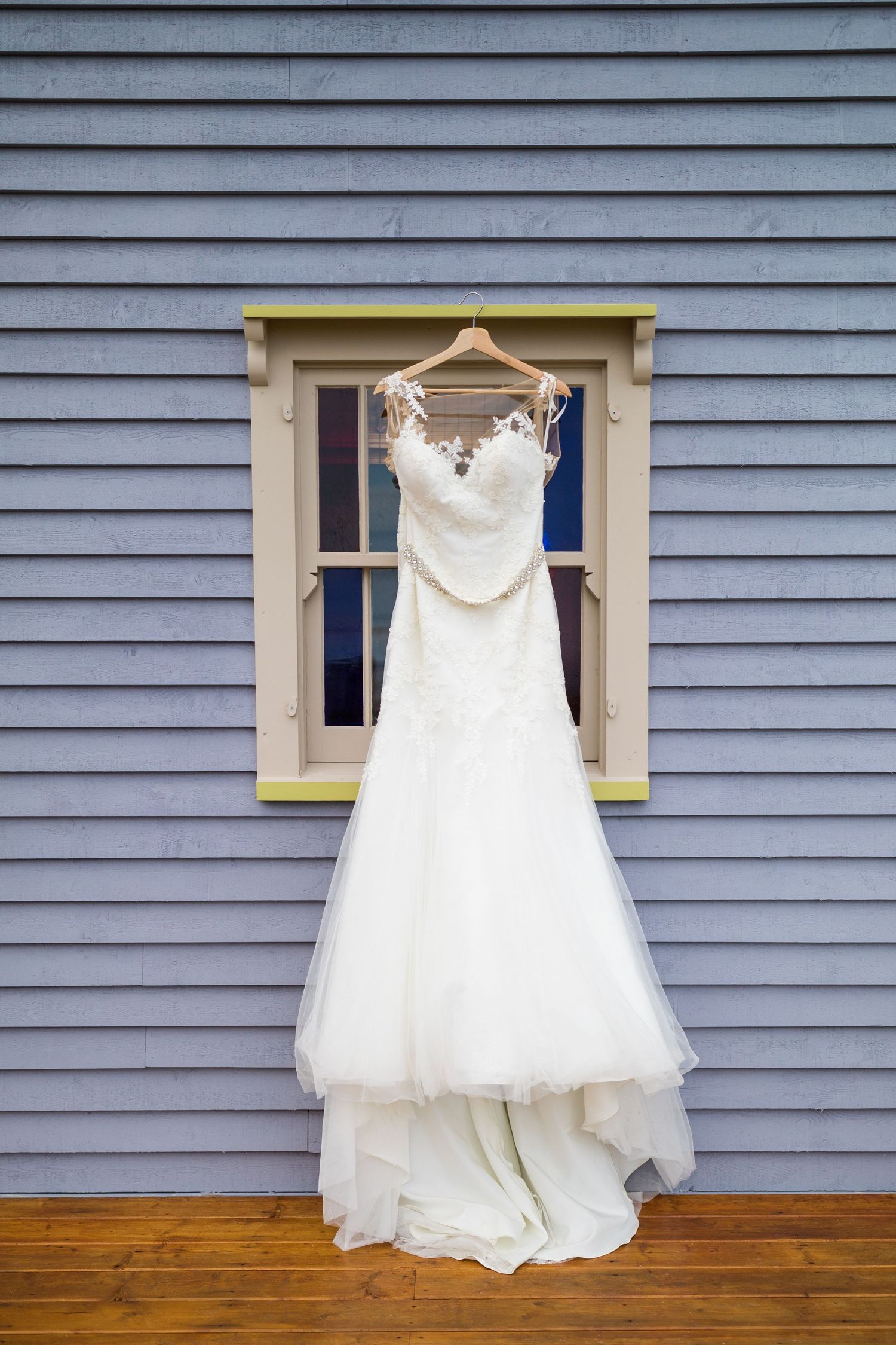 Bride dress hanging on window in Bonavista, Newfoundland