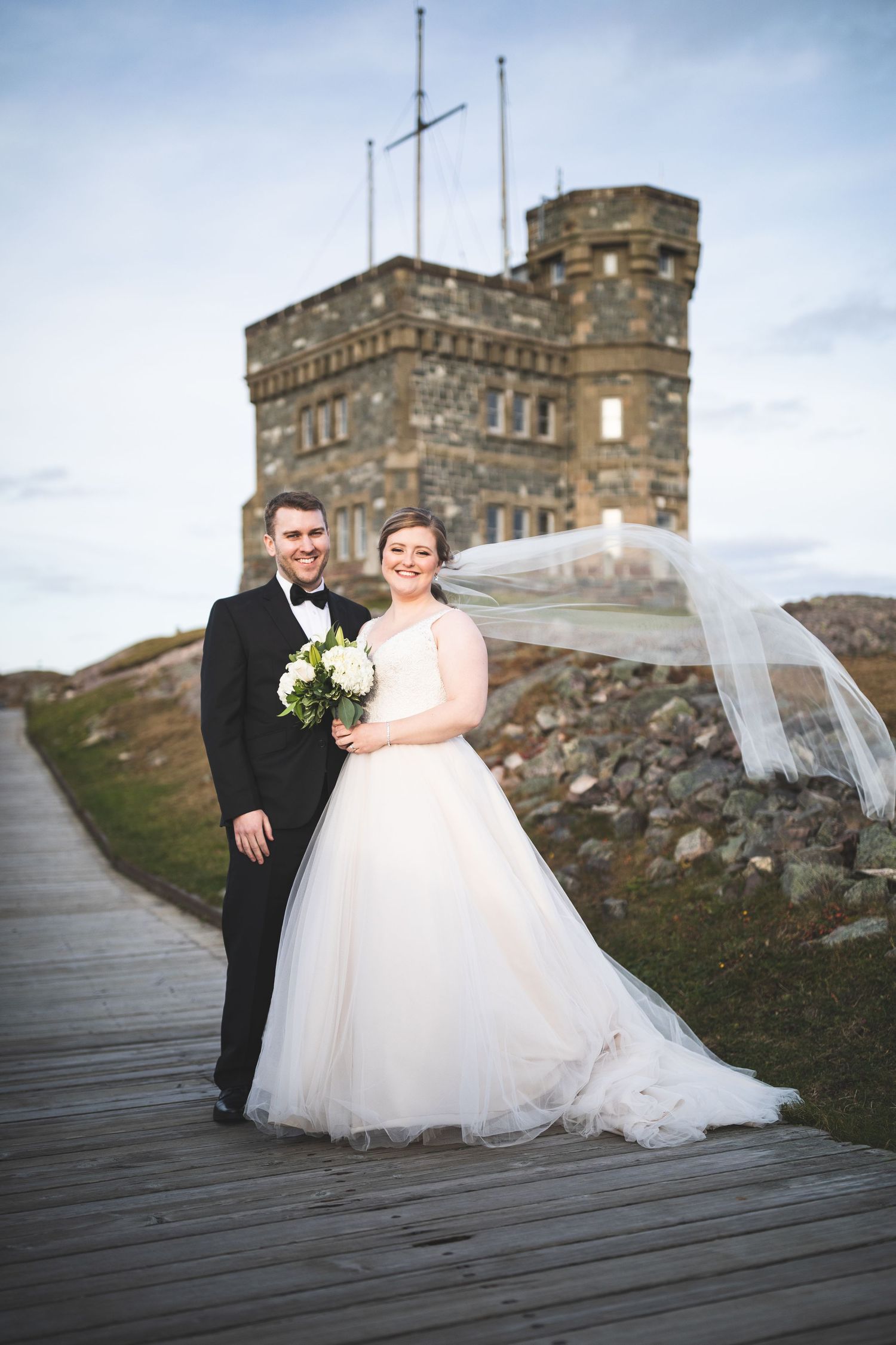 Wedding couple in front of Cabot Tower on Signal Hill, Newfoundland