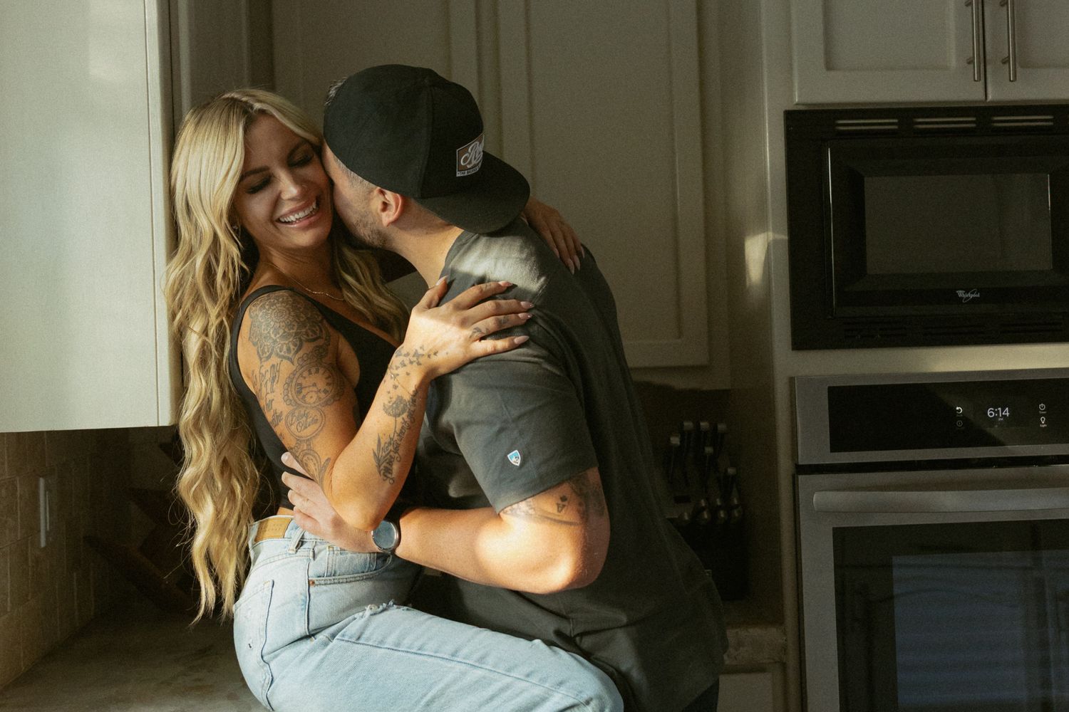 Couple laughing together during a relaxed engagement session on the Central Coast
