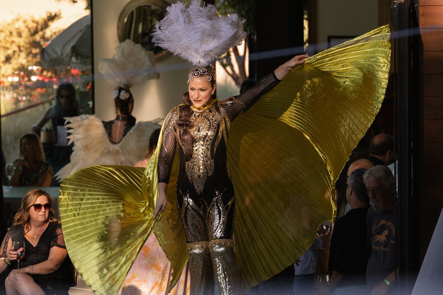 Stilt walker in costume towering over guests at a Paso Robles winery event