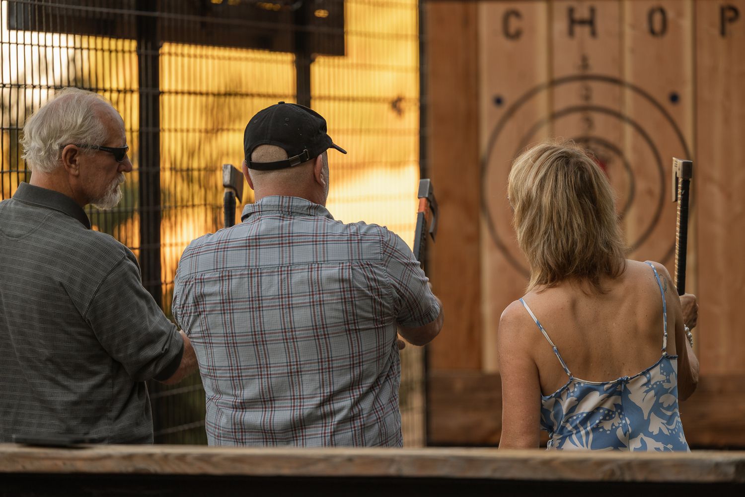 Guest throwing an ax at a winery party in Paso Robles