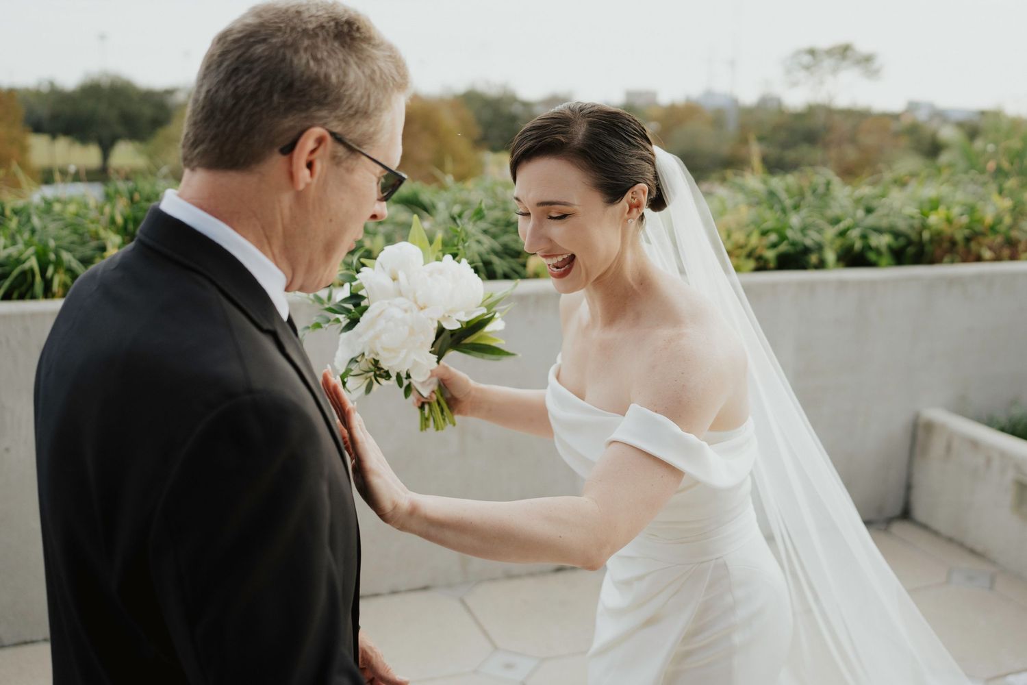A bride shares emotional moments with loved ones during pre-ceremony preparations.