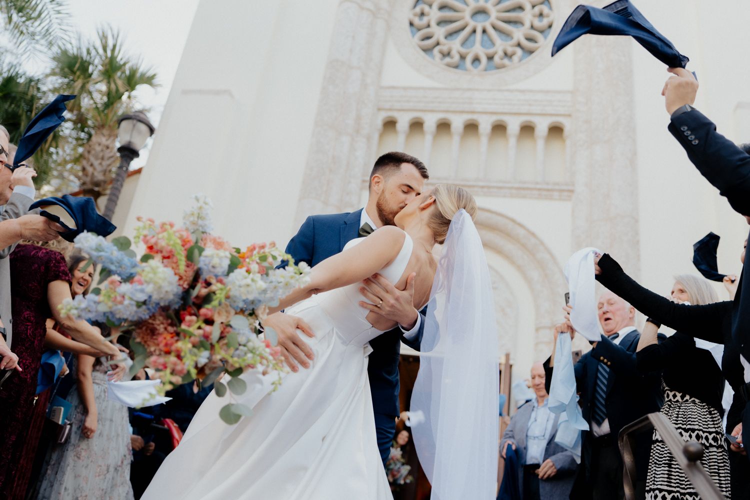 Newlywed couple sharing a romantic dance at their outdoor wedding reception with guests watching and celebrating at st james cathedral