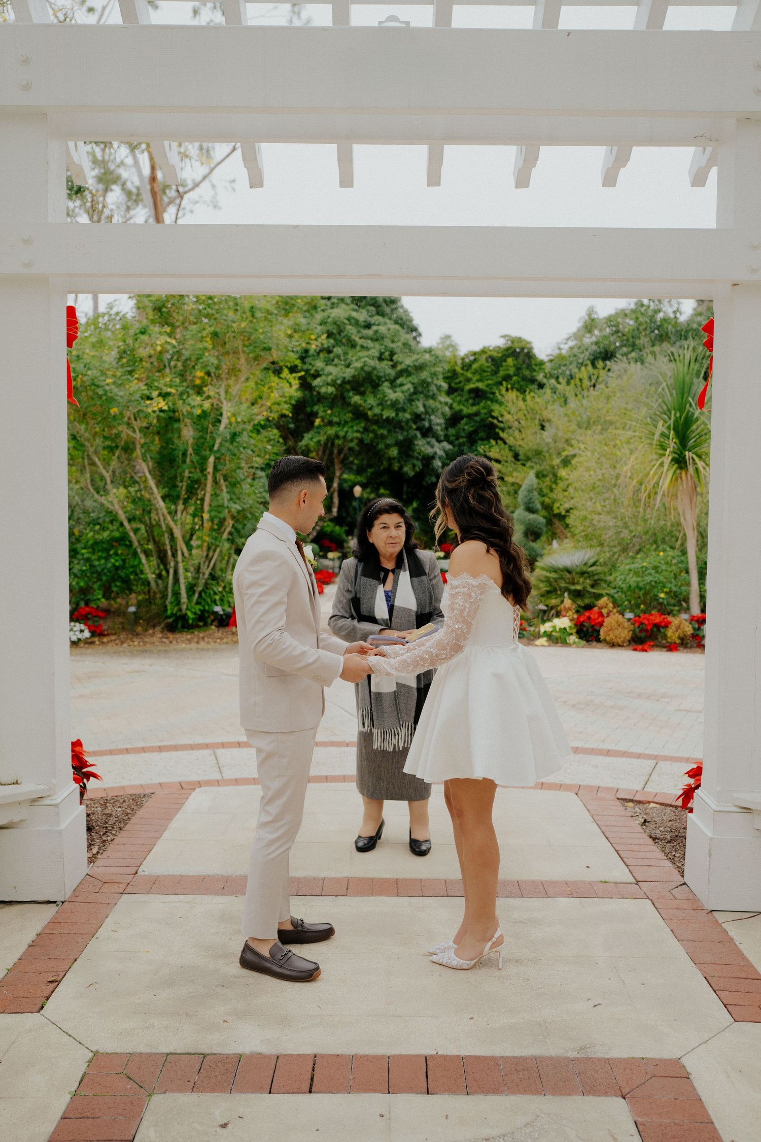 A sequence of photos showing a couple dancing together under a white pergola in a garden setting.