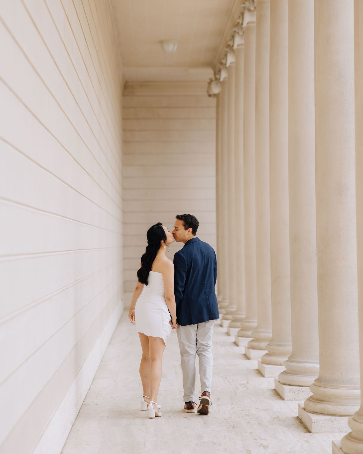 Couple sharing a gentle kiss during engagement photoshoot at Legion of Honor museum in SF.