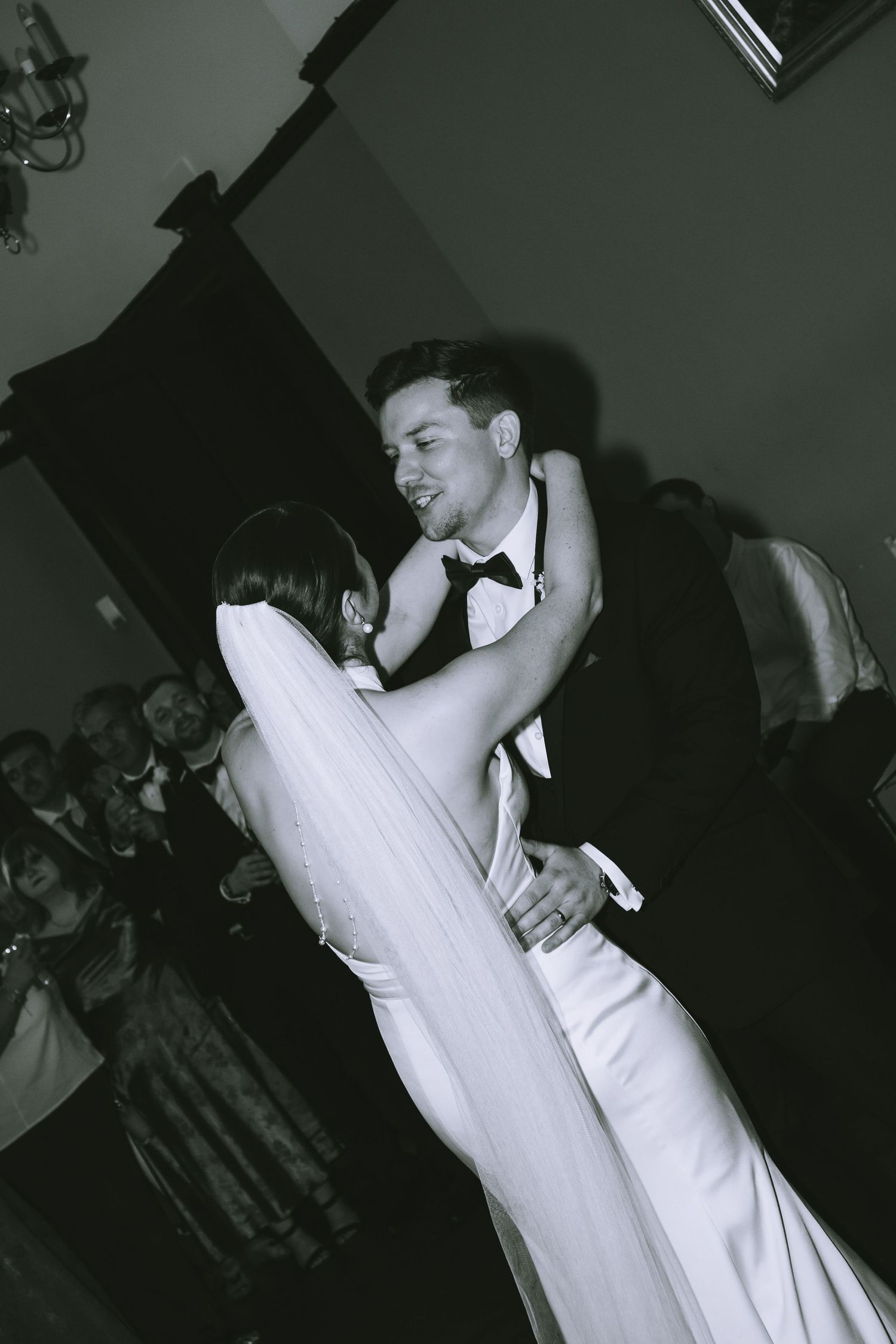 Black and white photo of bride and groom sharing intimate first dance at their wedding reception at Walton Hall & Gardens in Warrington
