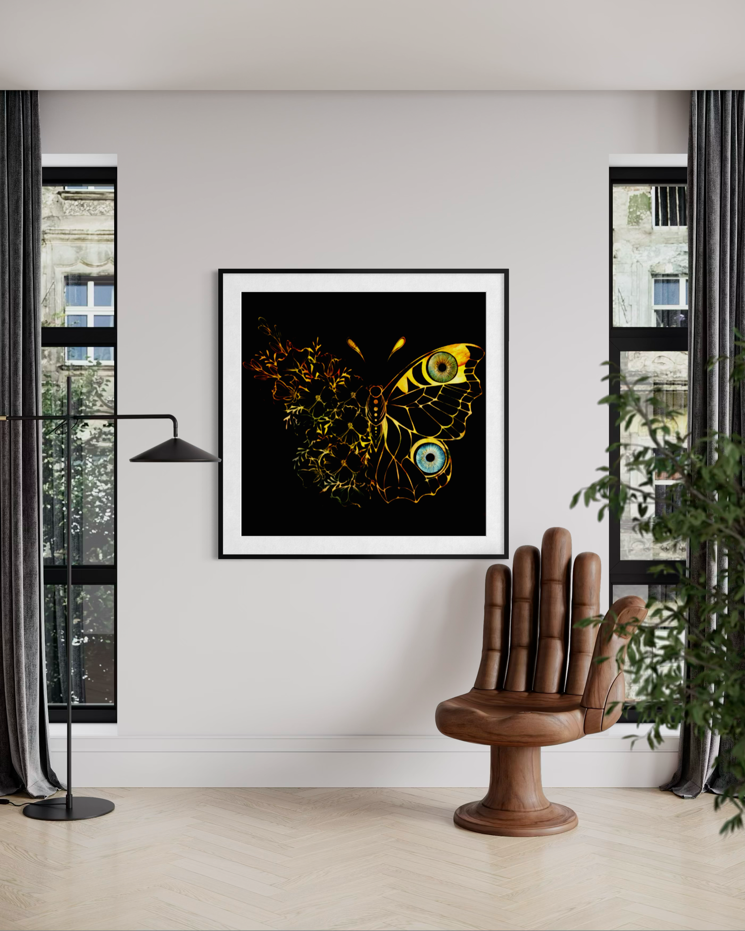 Glowing golden butterfly eye artwork in black frame displayed in modern minimalist interior.