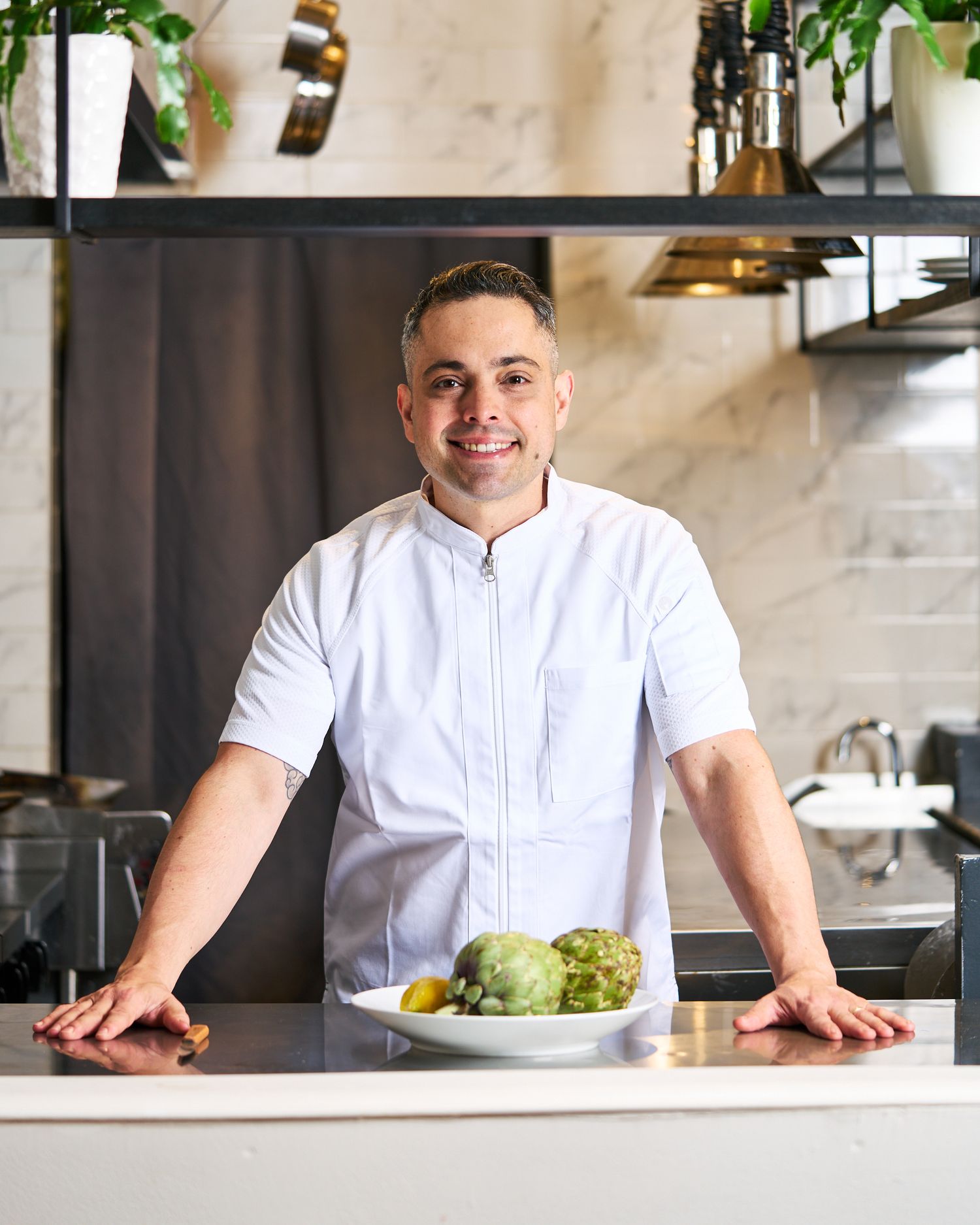 Light and airy portrait of chef at work in Forest Hills Queens New York.