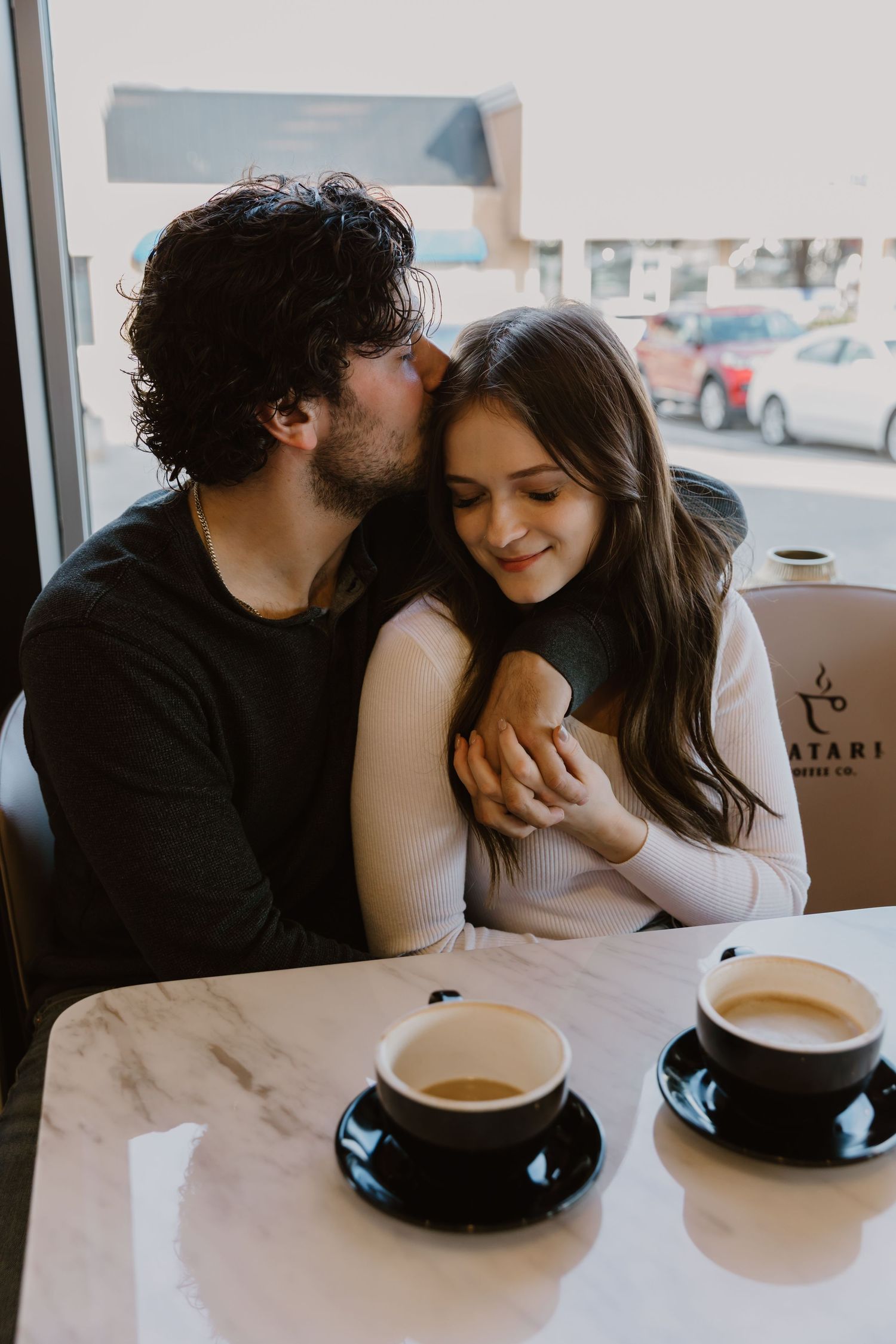 A romantic couple shares intimate moments over coffee at a cafe table in a series of connected photos.