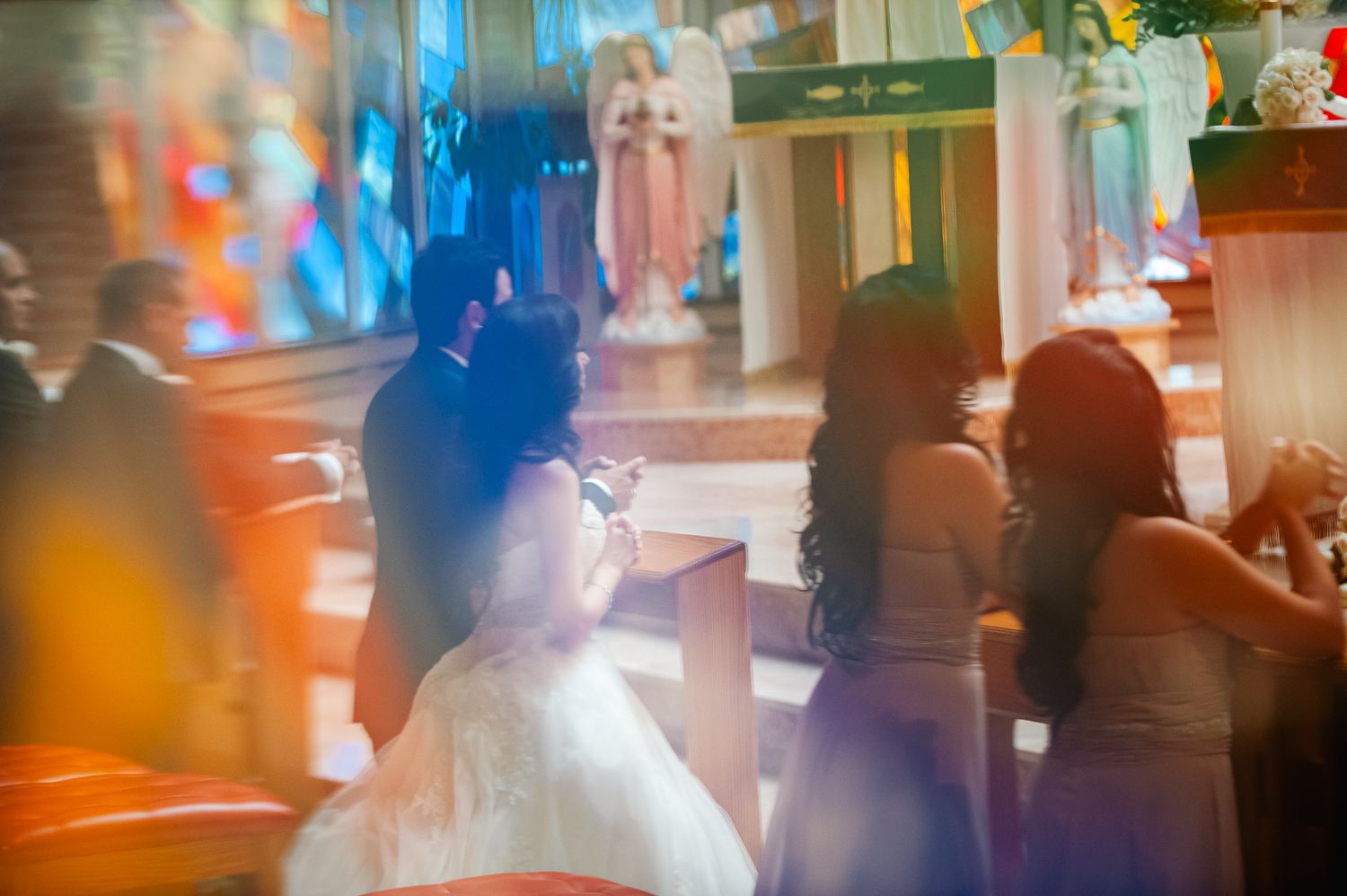 Abstract blurred scene in a bar or restaurant with silhouettes of people and colorful lighting effects.