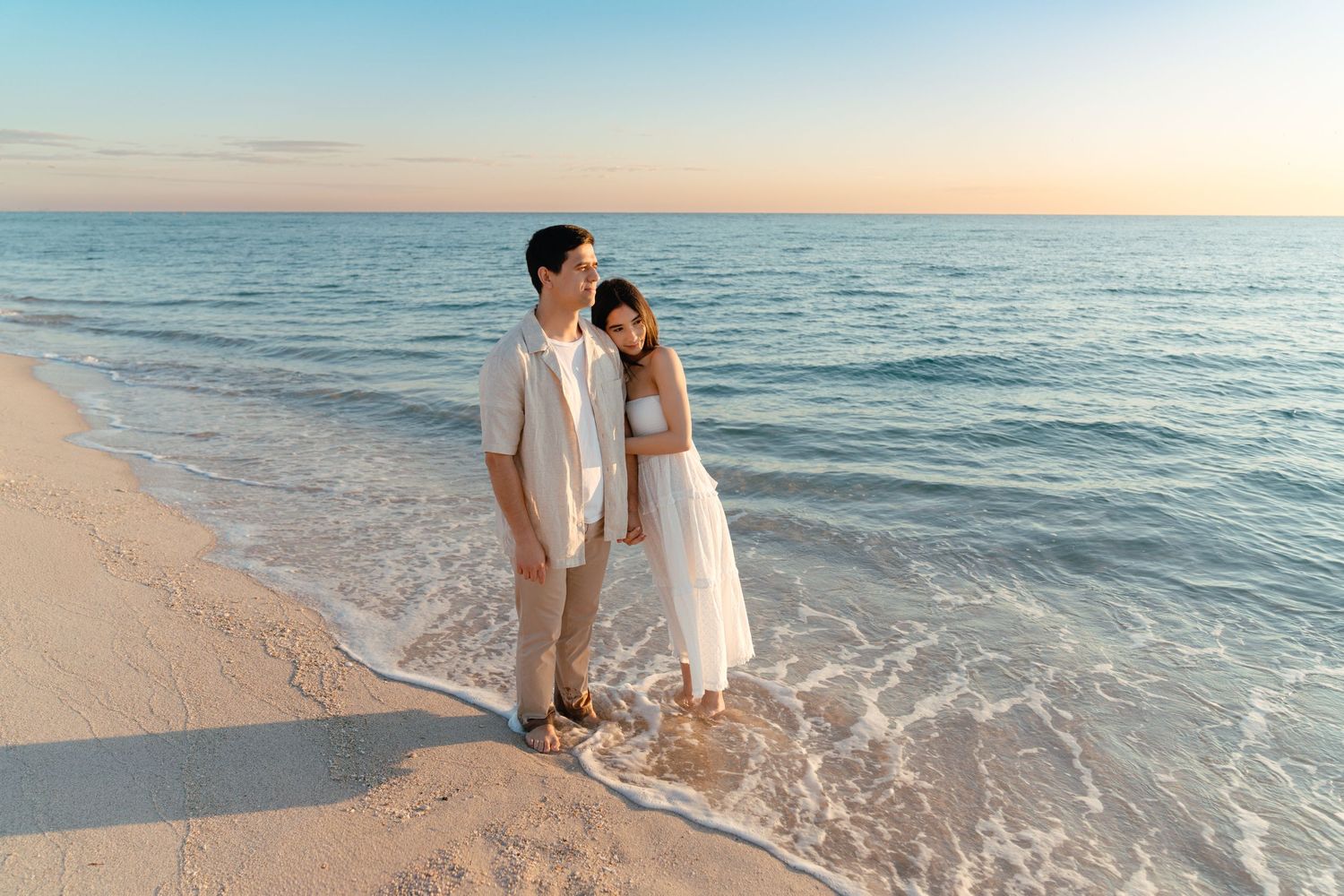 Miami lifestyle photoshoot – couple standing barefoot in the ocean