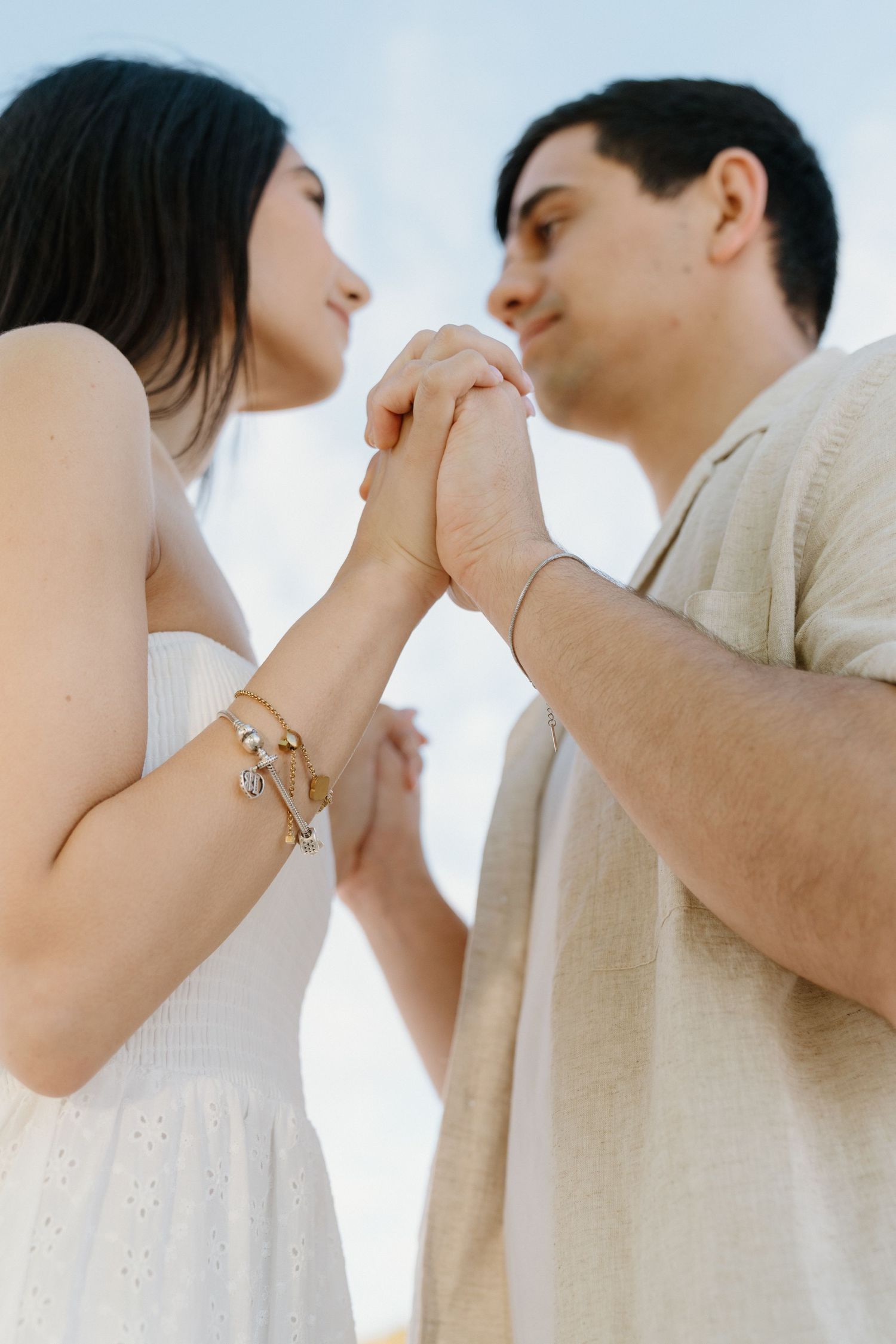 Intimate Miami photoshoot – couple holding hands and gazing into each other's eyes