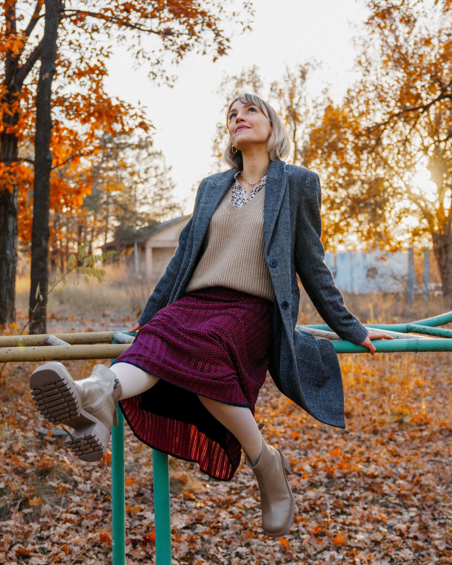 Playful portrait of a woman sitting, captured from a low angle during a photoshoot