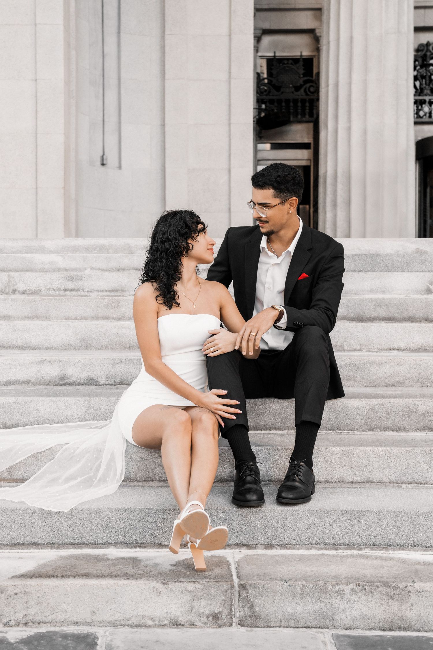 Miami courthouse engagement (elopement/mini wedding) photoshoot – couple gazing at each other on the stairs