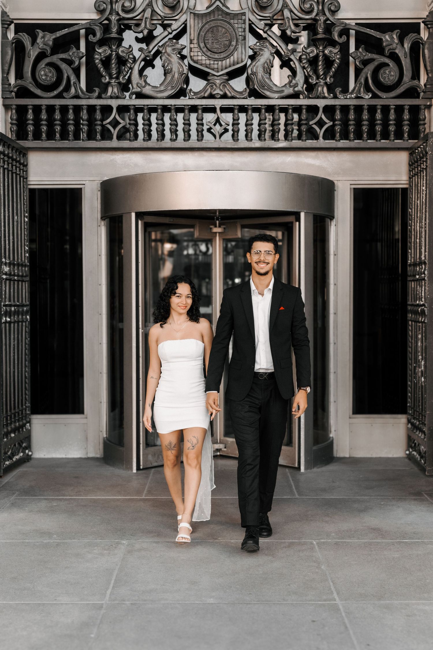 Miami courthouse engagement (elopement/mini wedding) photoshoot – couple walking out hand in hand