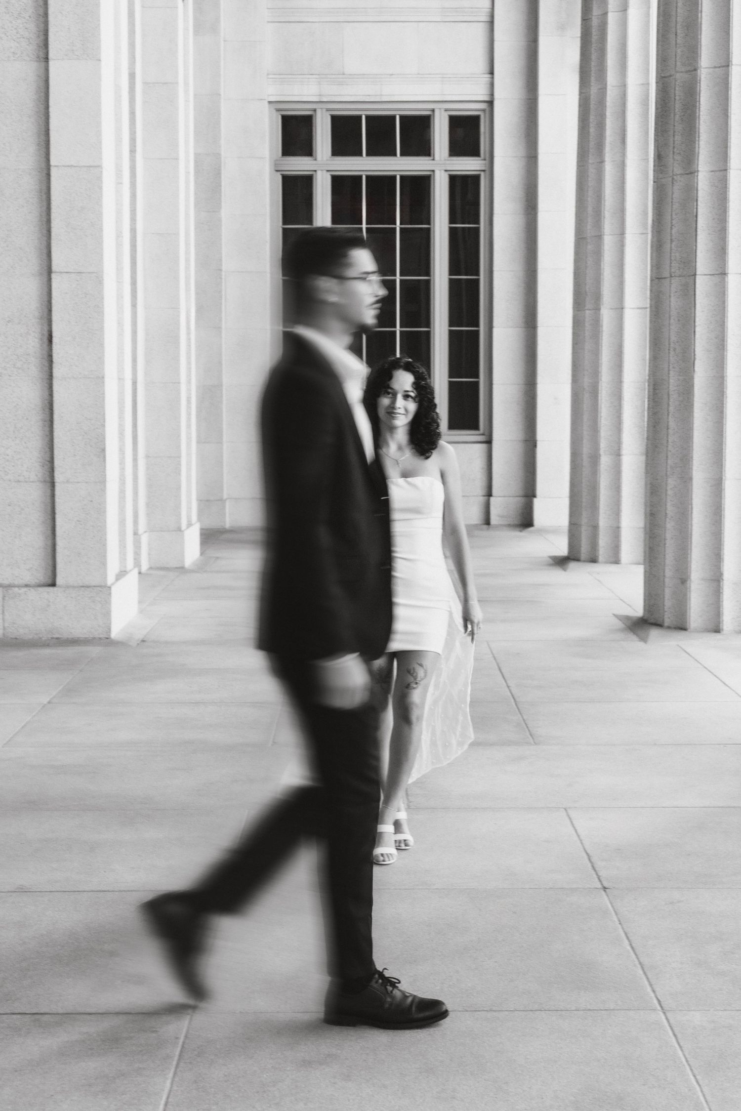 Black and white Miami engagement (elopement/mini wedding) portrait – bride smiling at groom