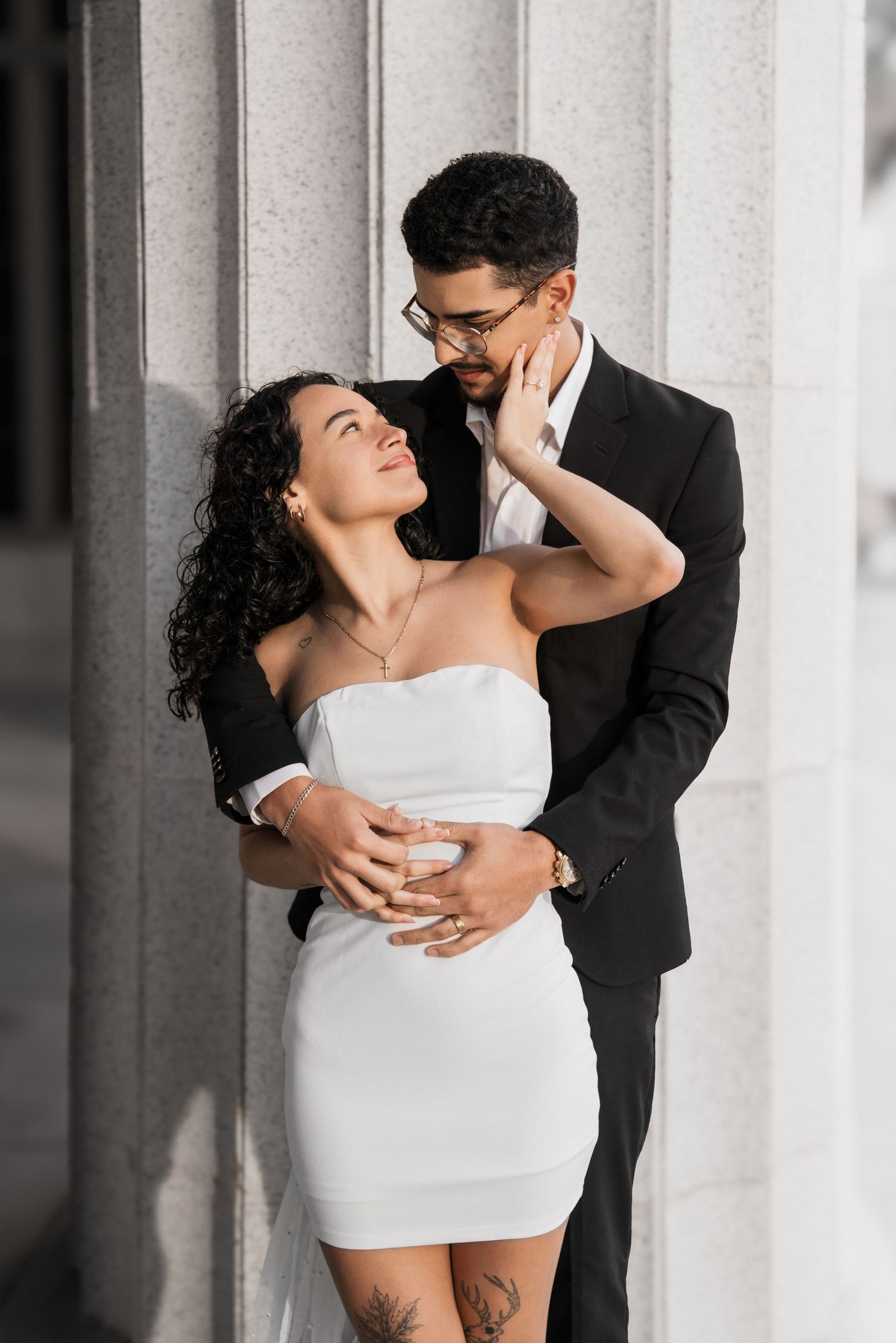 Romantic Miami courthouse engagement (elopement/mini wedding) portrait – couple standing by the columns