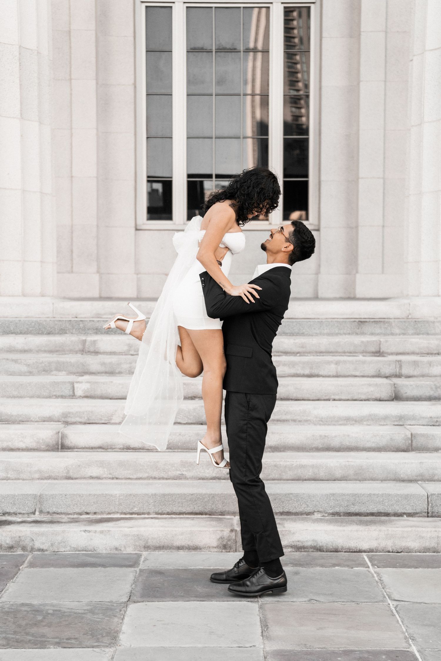 Romantic Miami engagement (elopement/mini wedding) photoshoot – groom lifting bride in his arms