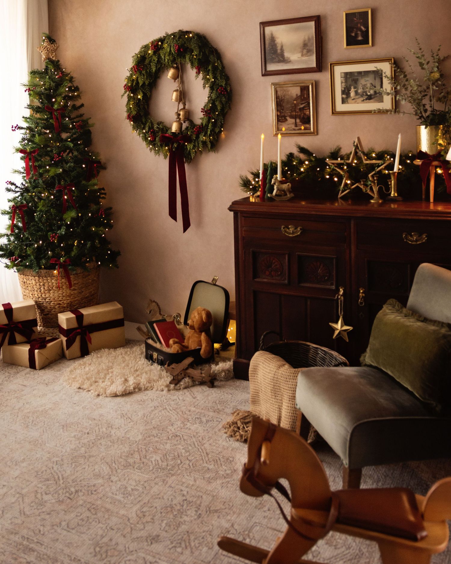 Cozy Christmas living room with decorated tree, gifts, wreath, candles, and a wooden rocking horse on beige carpet.