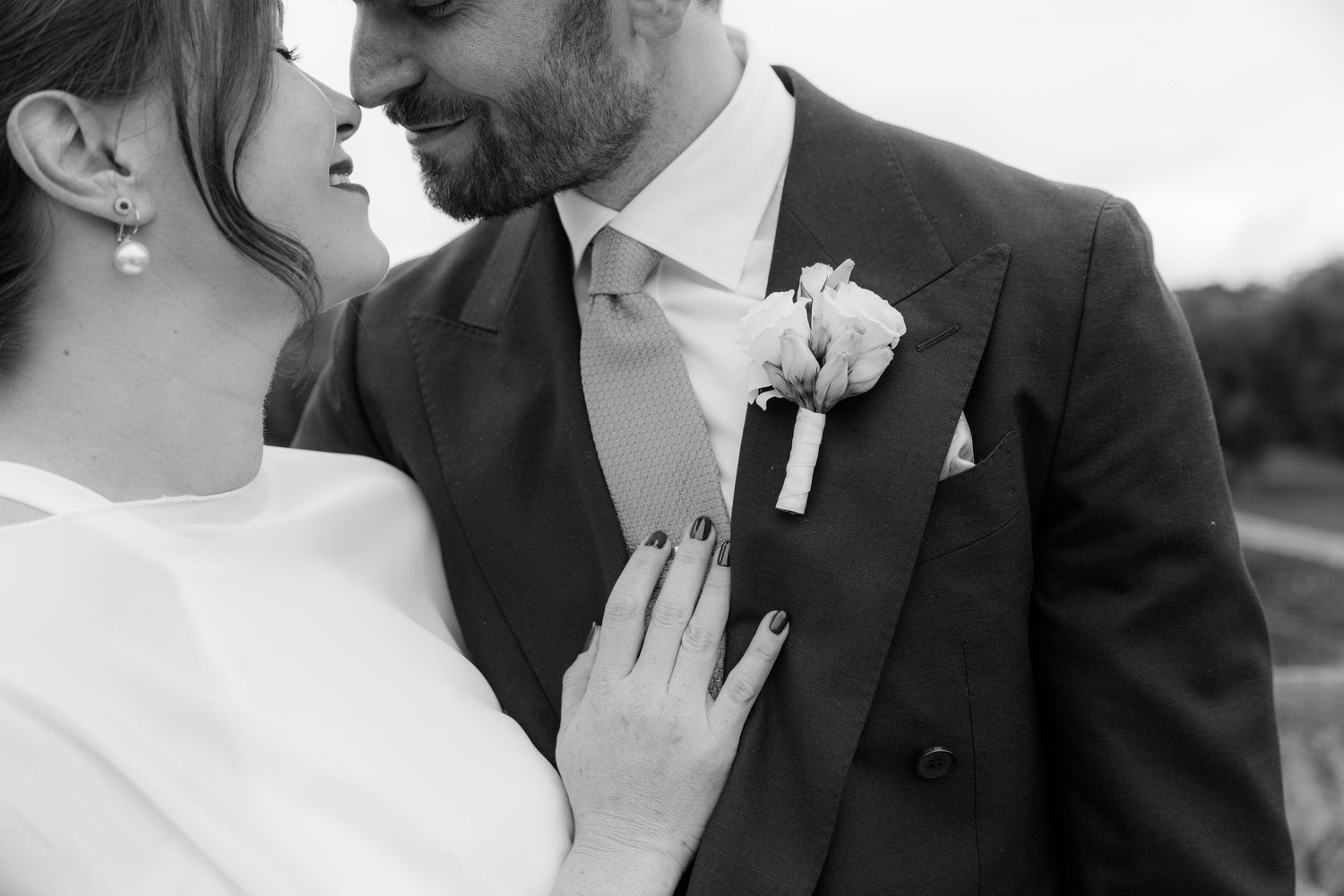Black and white wedding photography collage showing intimate romantic moments between newlyweds.