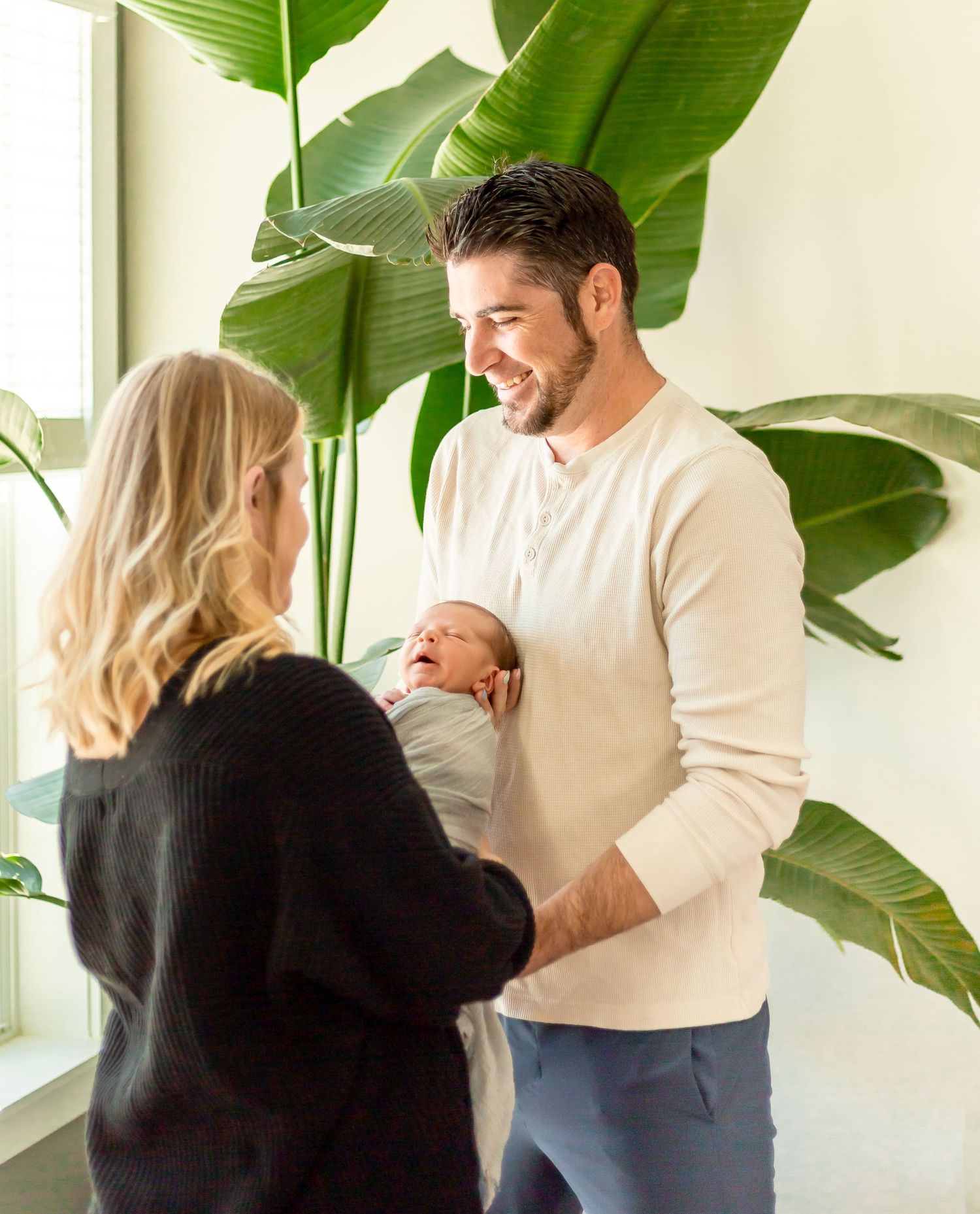 Newborn Photography with a timeless, minimal, bright and crisp approach. Greenery. Plants. Nursery.