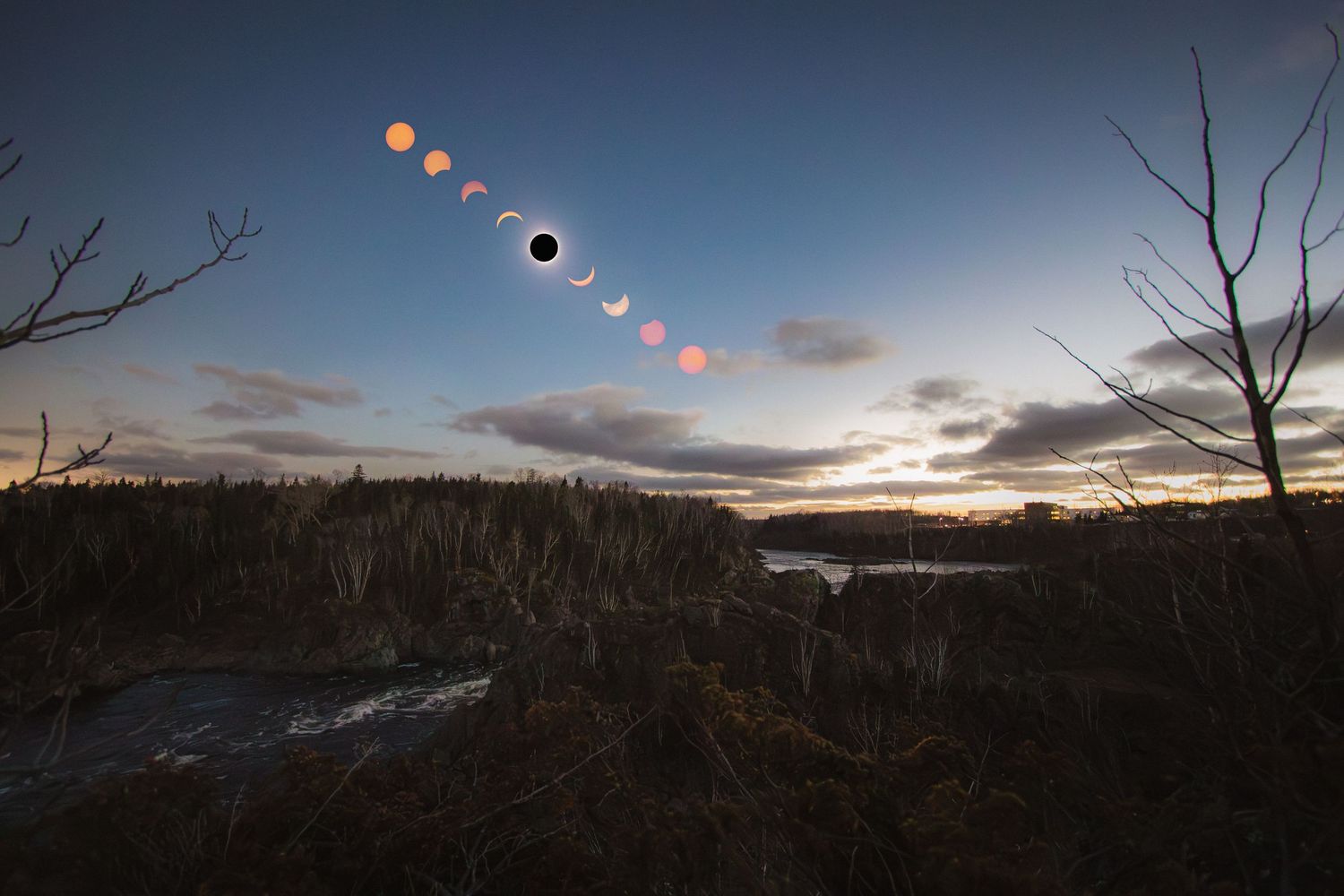 Time-lapse sequence showing phases of a solar eclipse across a cloudy sky.