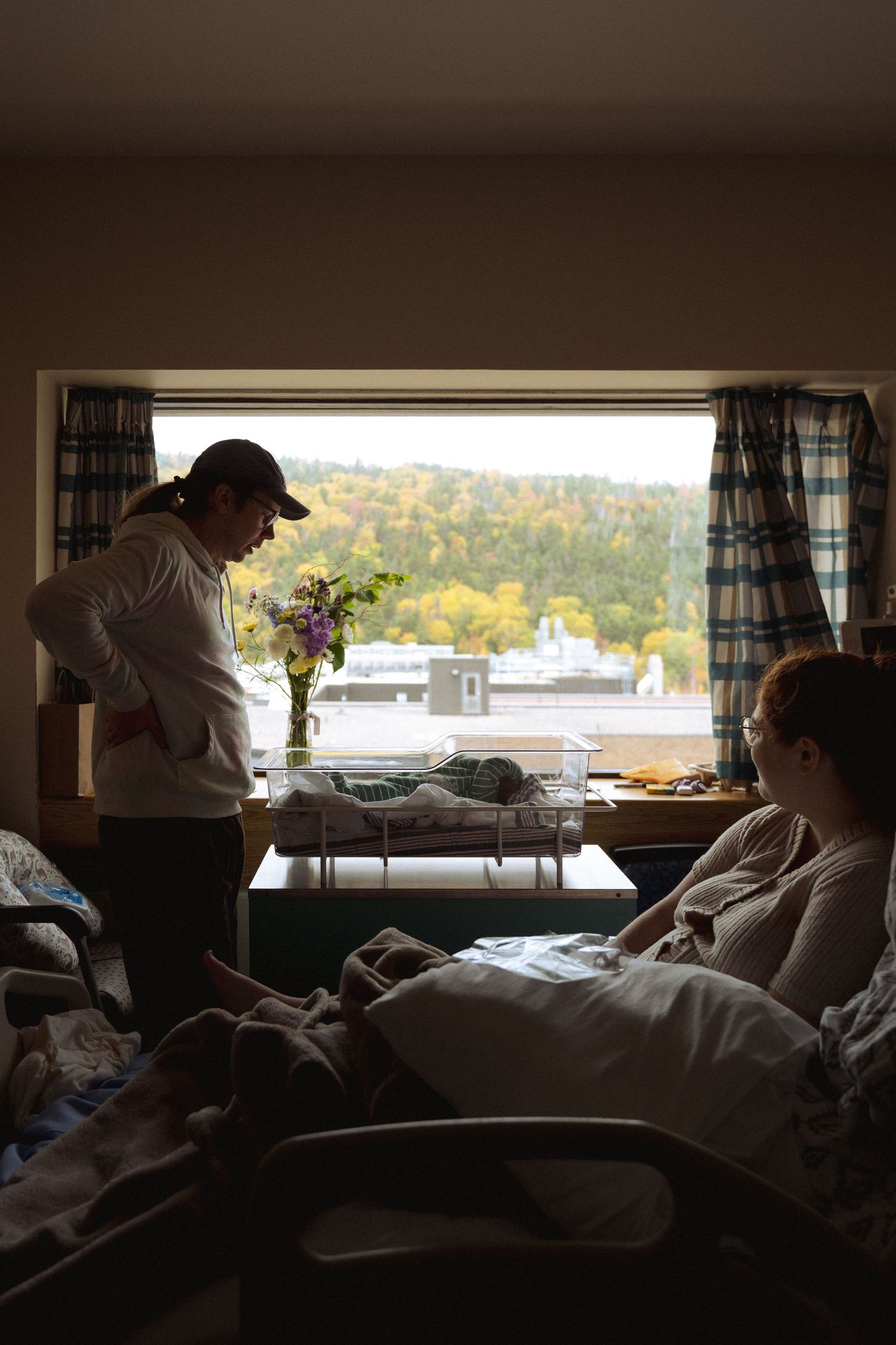 A sequence of hospital room views showing silhouettes against windows with medical equipment and beds visible.