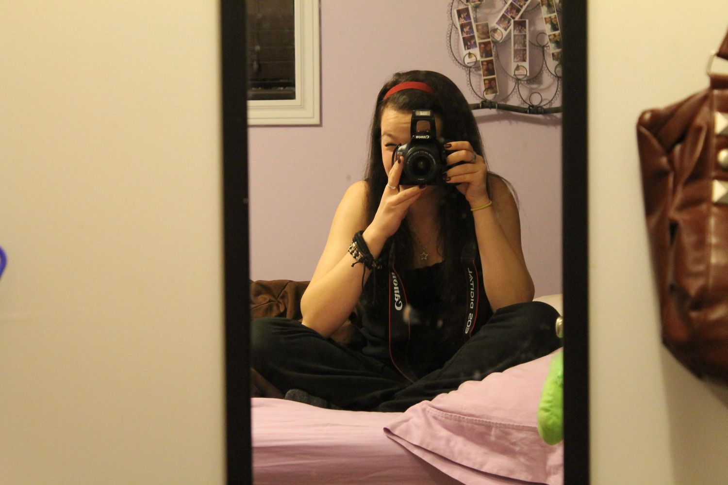 Series of mirror selfie photographs taken in a dimly lit room.