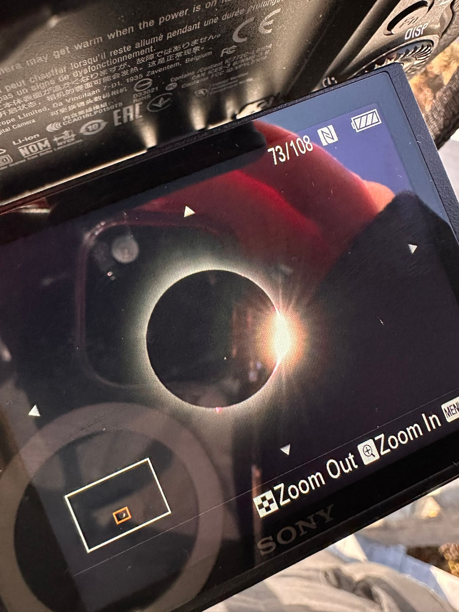 Camera display showing solar eclipse photography settings and menu options.
