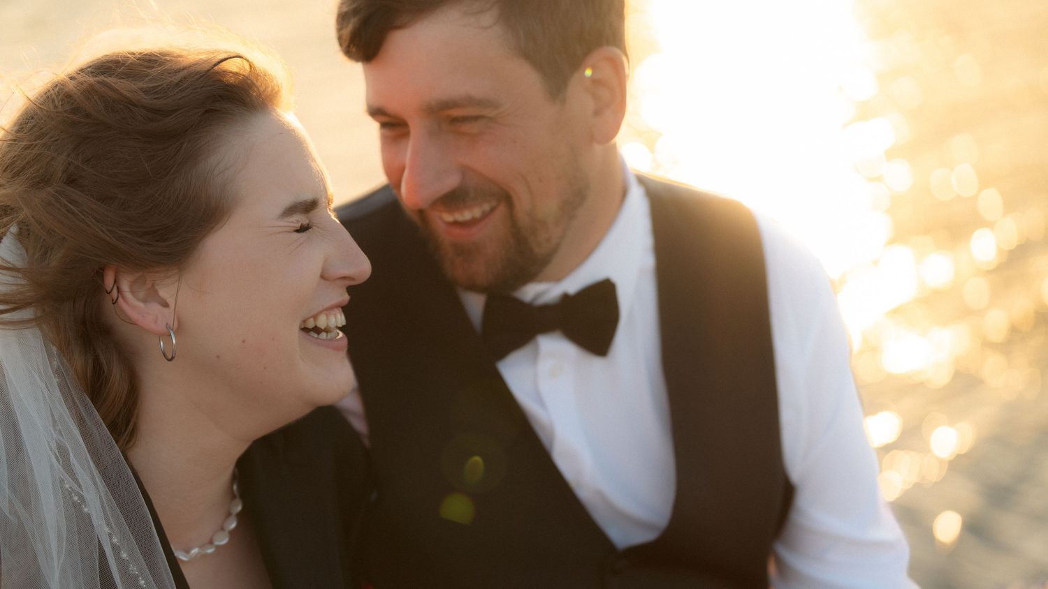 Romantic sunset moment captured on a dock with warm golden light.