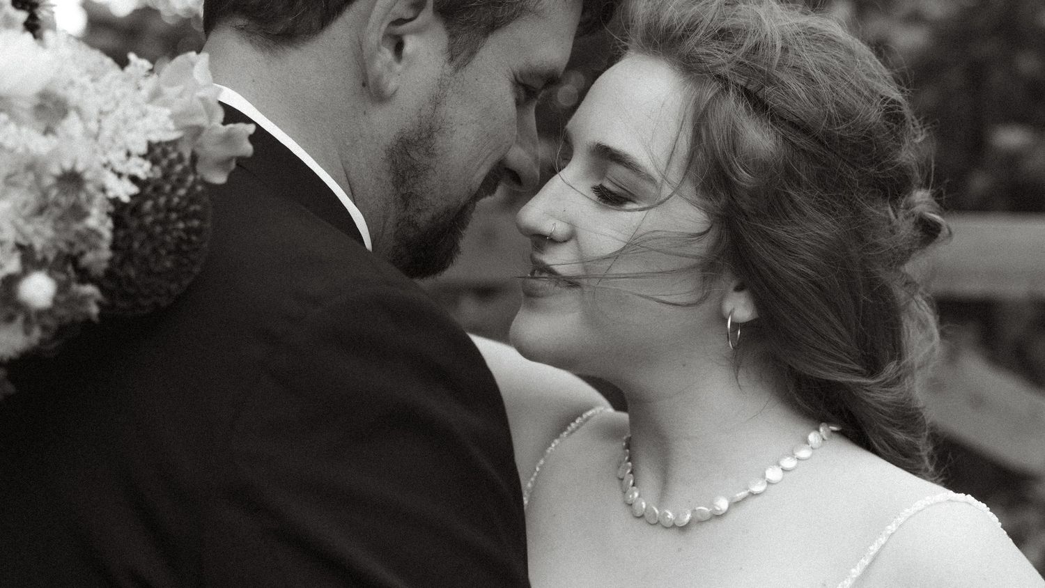 Black and white wedding photos arranged in a collage showing intimate moments between a couple on their special day.