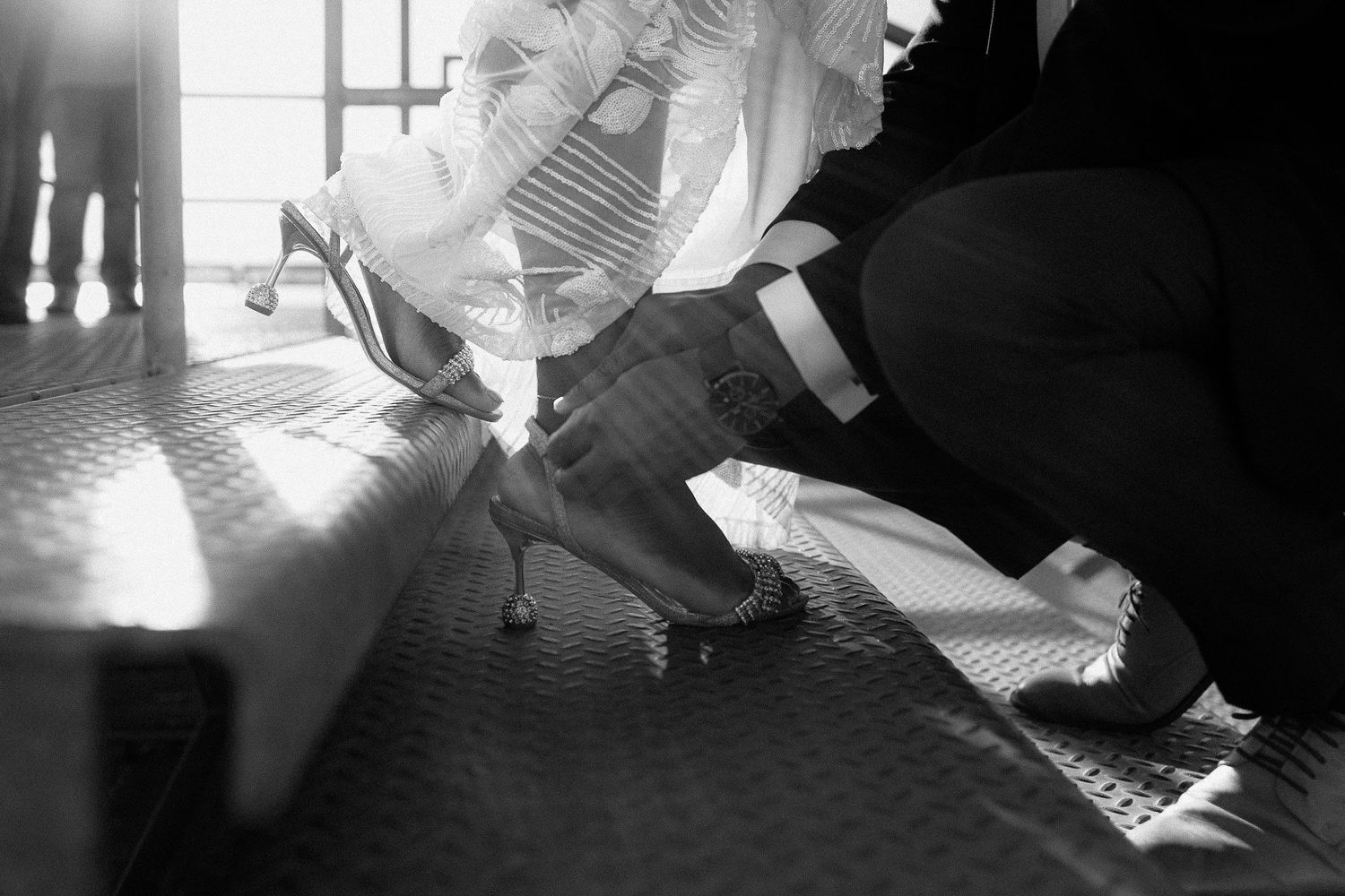 A black and white collage of vintage wedding photos showing intimate moments and details of a traditional ceremony.
