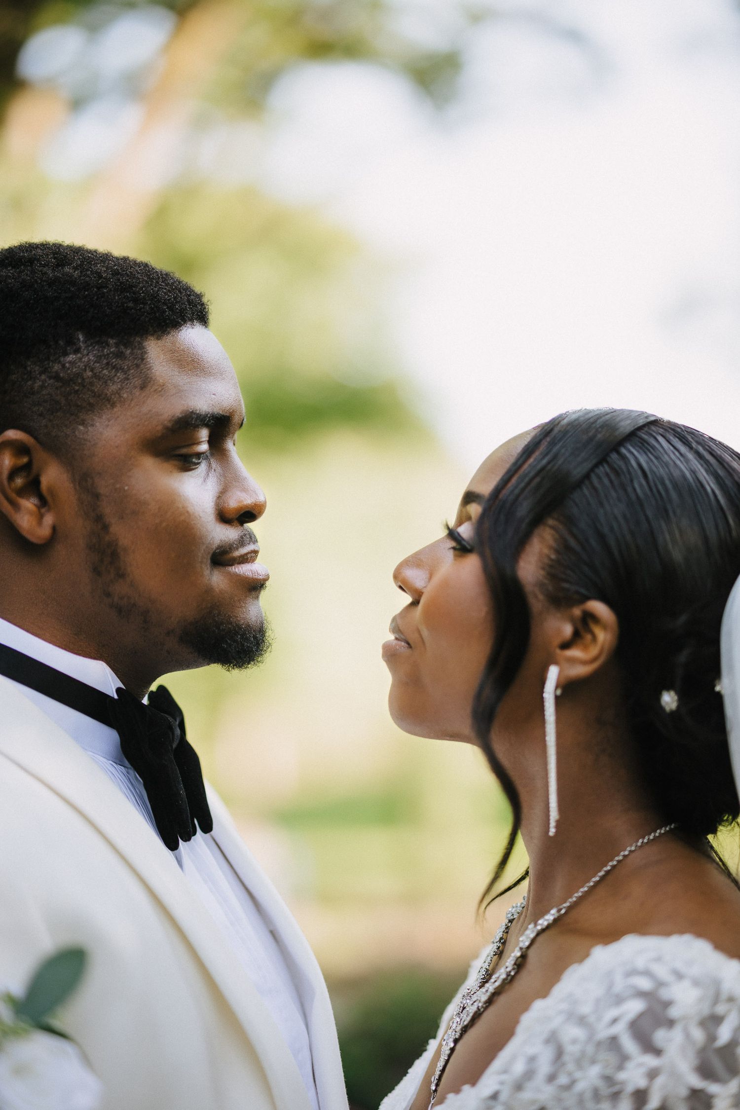 A romantic wedding photo sequence showing a couple in formal attire sharing an intimate moment outdoors.