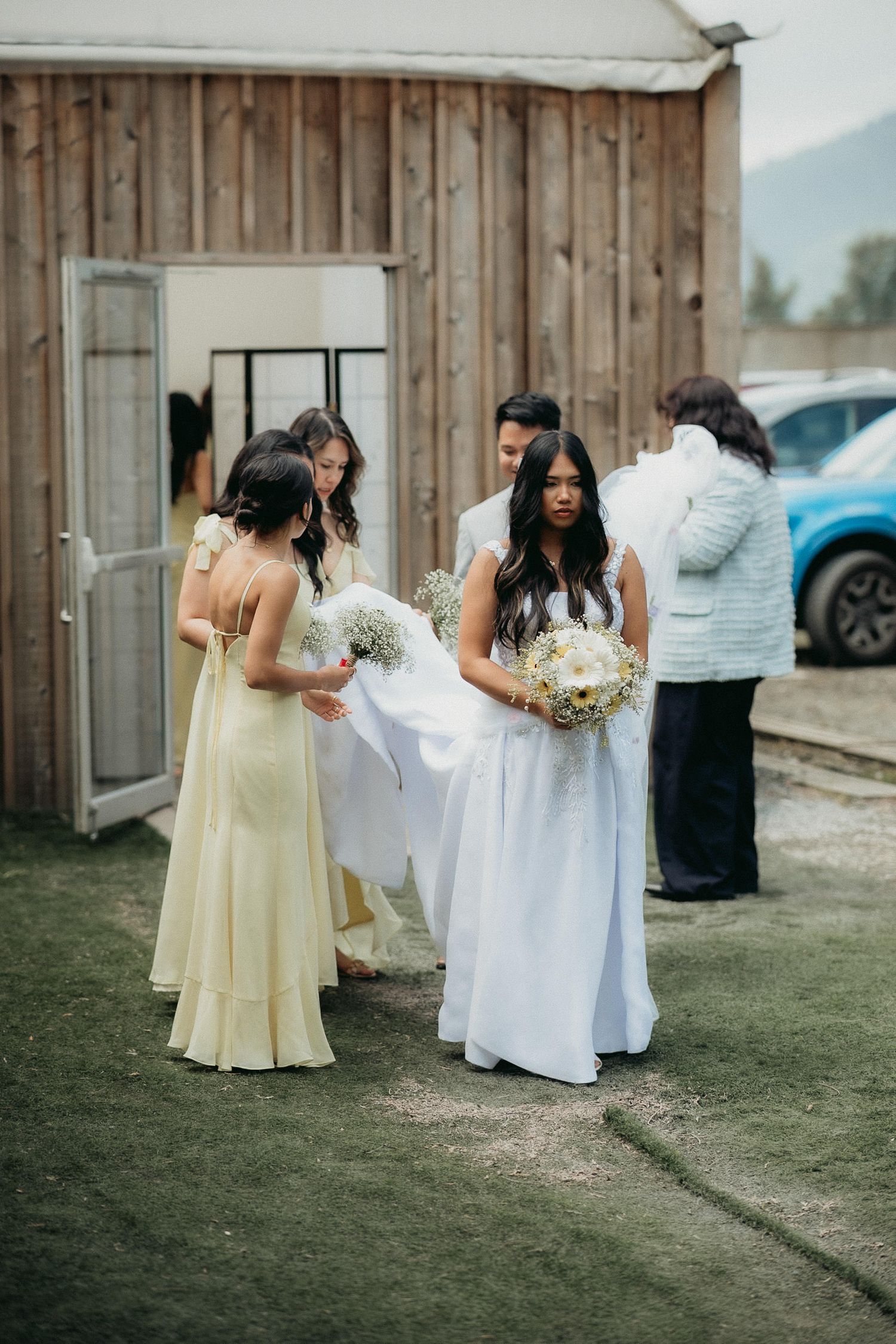 A sequence of wedding photos showing bridesmaids in yellow dresses helping adjust the bride's white dress outdoors.