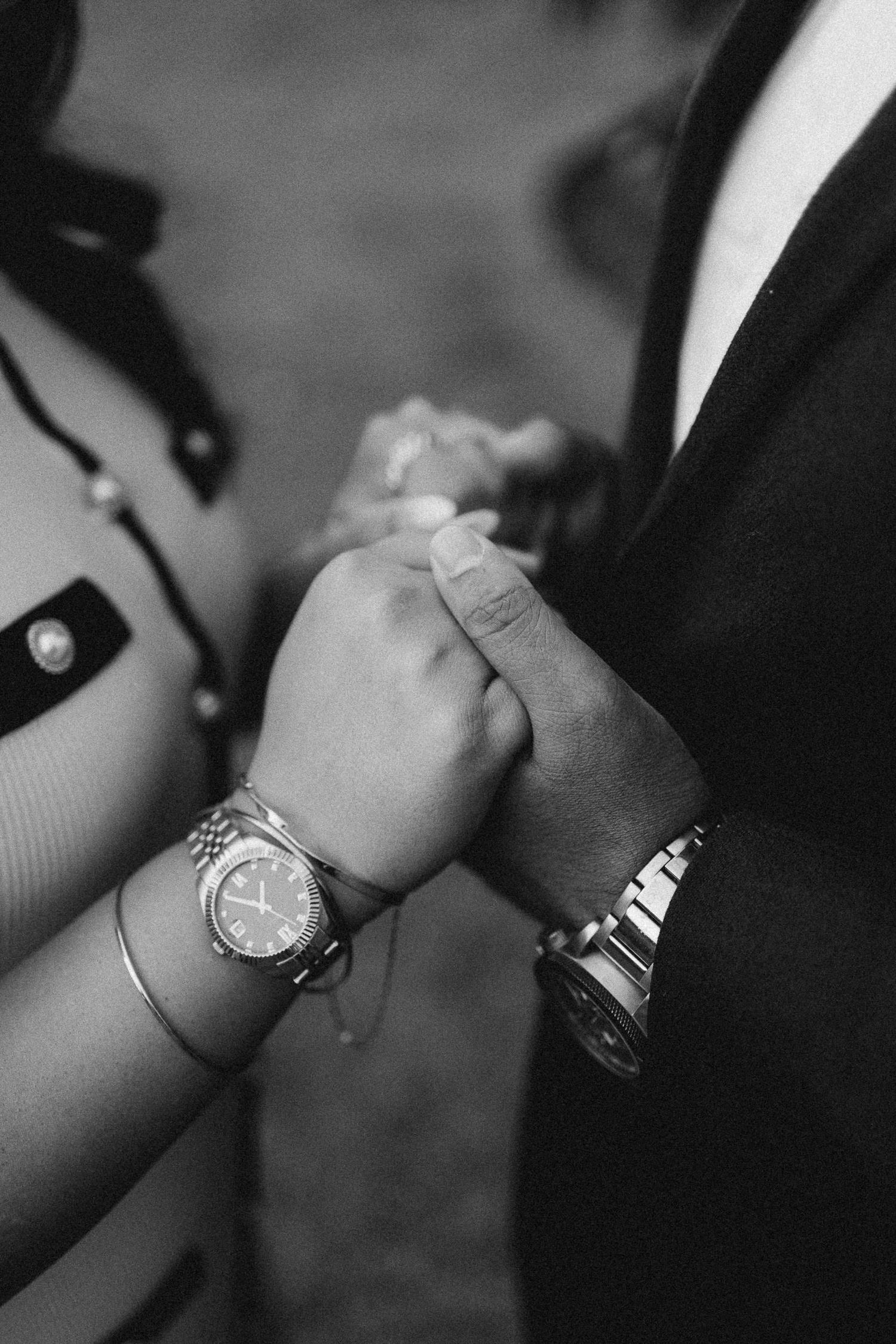 Black and white close-up photos of wrists wearing different luxury watches arranged in a series.