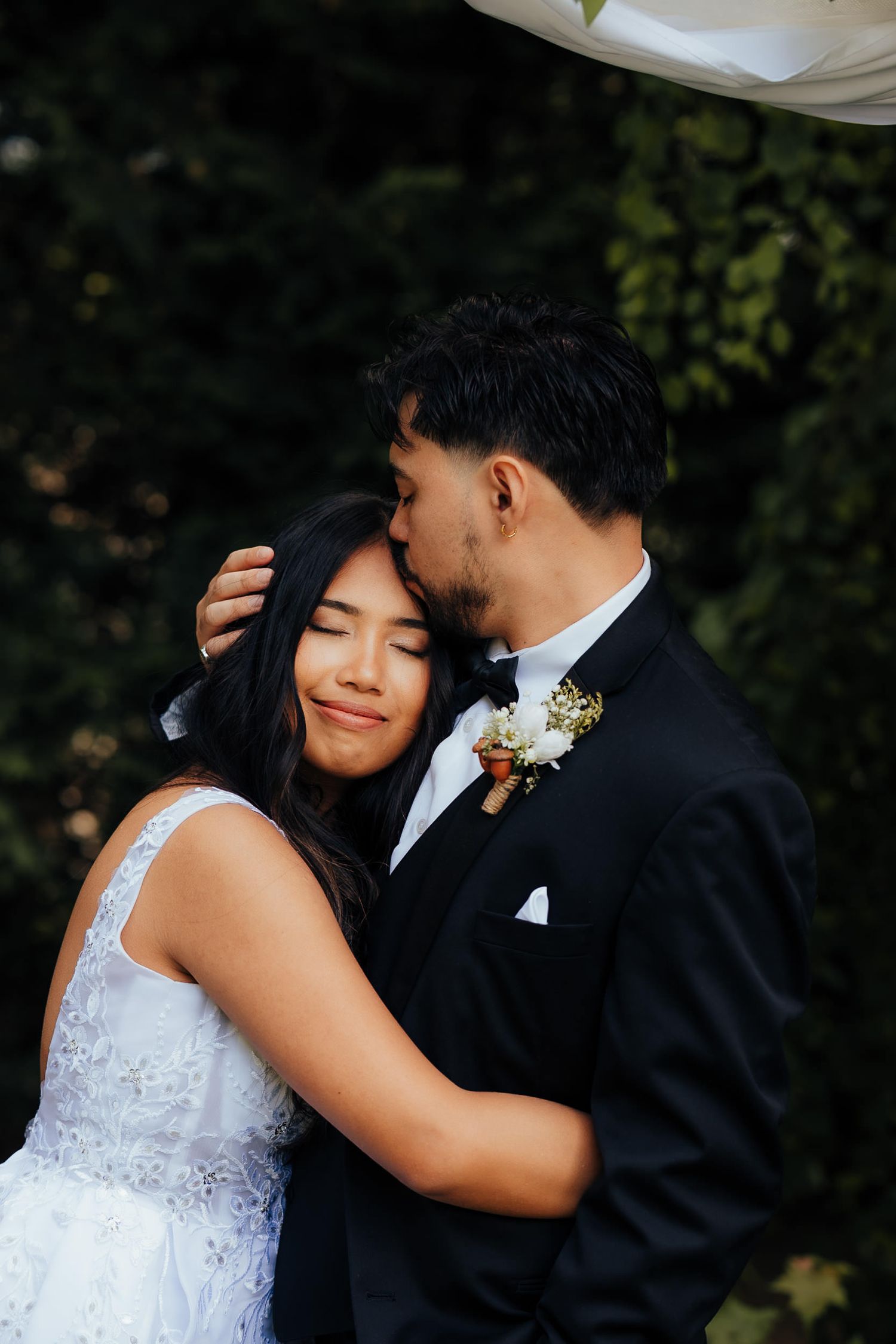 Series of romantic wedding portraits showing tender moments between couple in black and white attire.
