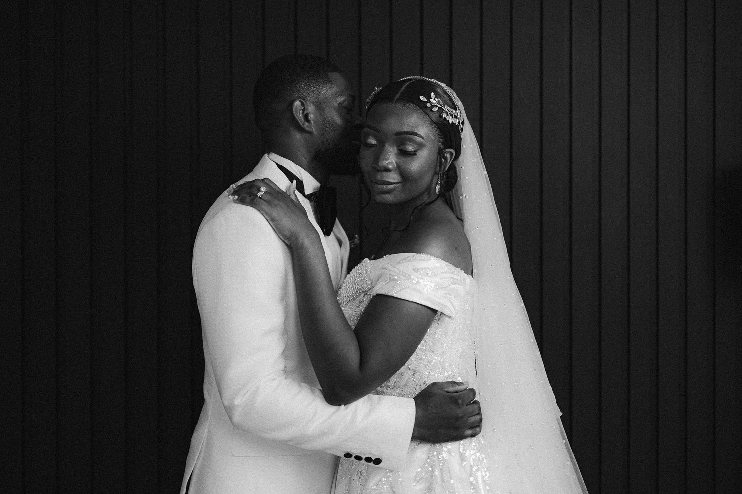 A romantic black and white wedding photo collage showing tender moments between the bride and groom.