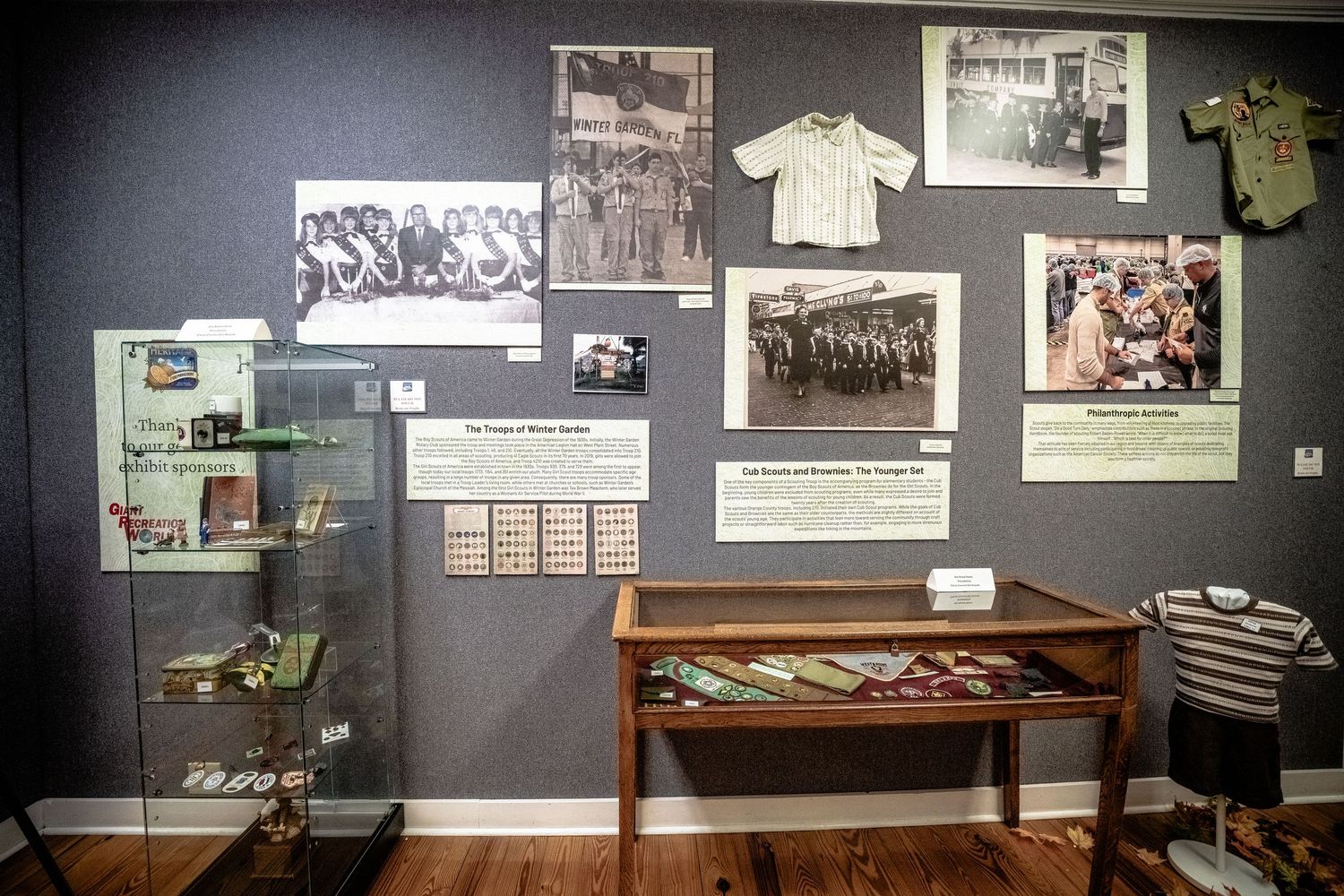 Museum wall display featuring vintage photographs and historical memorabilia.