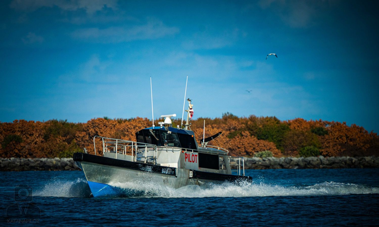 A series of panoramic photos showing a fishing boat navigating through rough ocean waves near a rocky coastline.