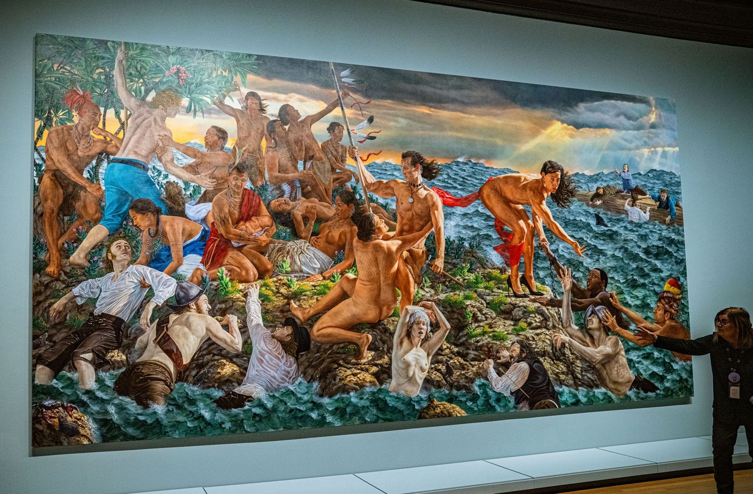 A panoramic museum mural depicting a dramatic historical battle scene with vibrant colors and dynamic figures in action.