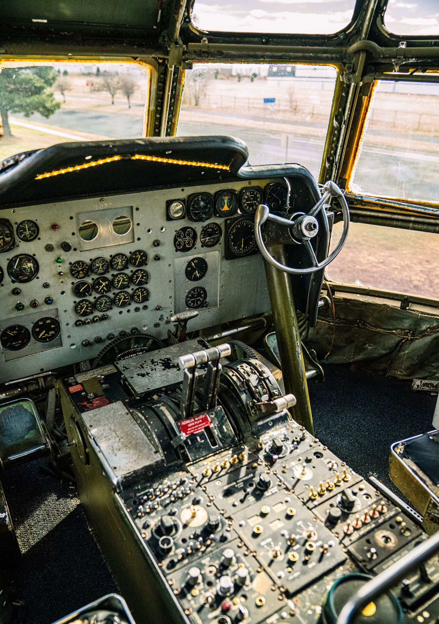 Vintage aircraft cockpit control panels showing complex arrays of gauges, switches and instruments in multiple views.
